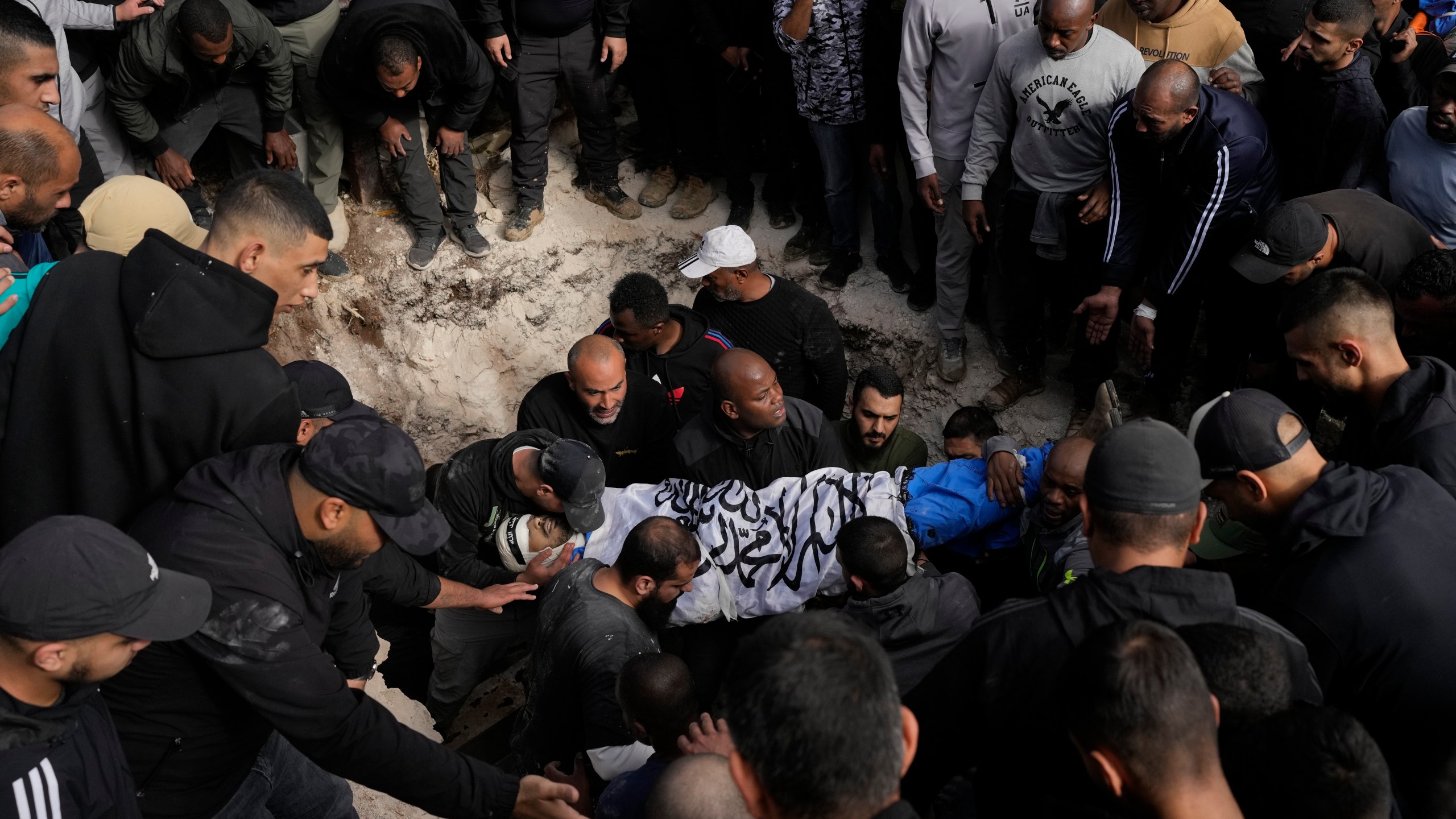 A Palestinian killed during an Israeli army operation is buried in the West Bank city of Tulkarem, Thursday, Dec. 26, 2024. (AP Photo/Matias Delacroix)