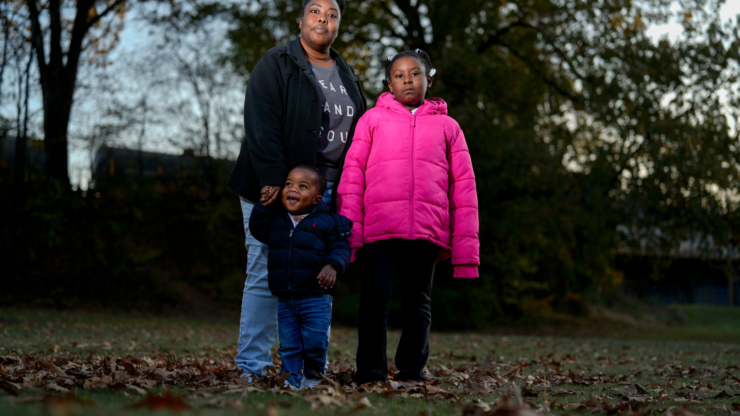 Anika Chillis stands for a photo with her children Makhi 2, and Myla 9, Monday, Dec. 2, 2024, in Memphis, Tenn. (AP Photo/George Walker IV)