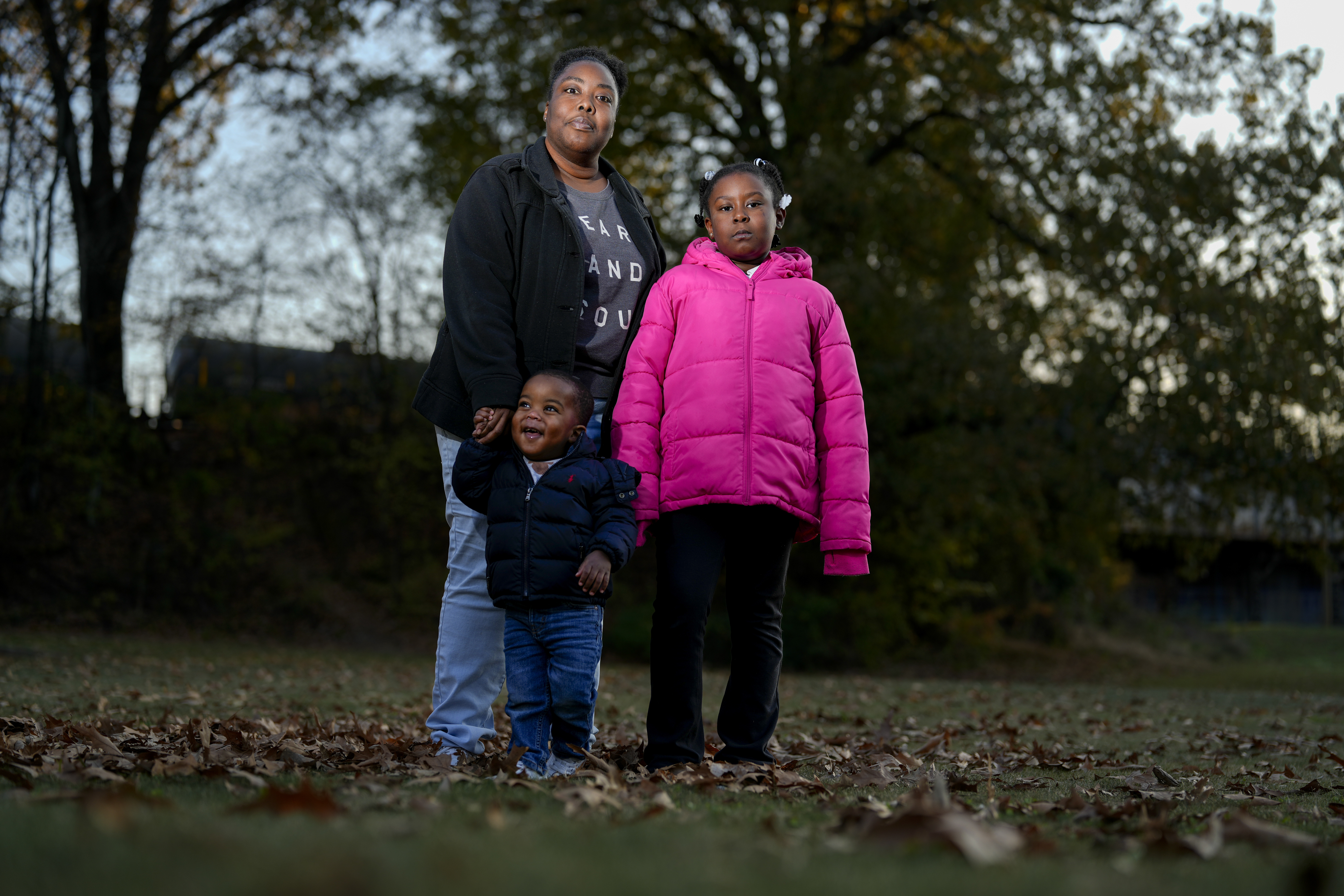 Anika Chillis stands for a photo with her children Makhi 2, and Myla 9, Monday, Dec. 2, 2024, in Memphis, Tenn. (AP Photo/George Walker IV)