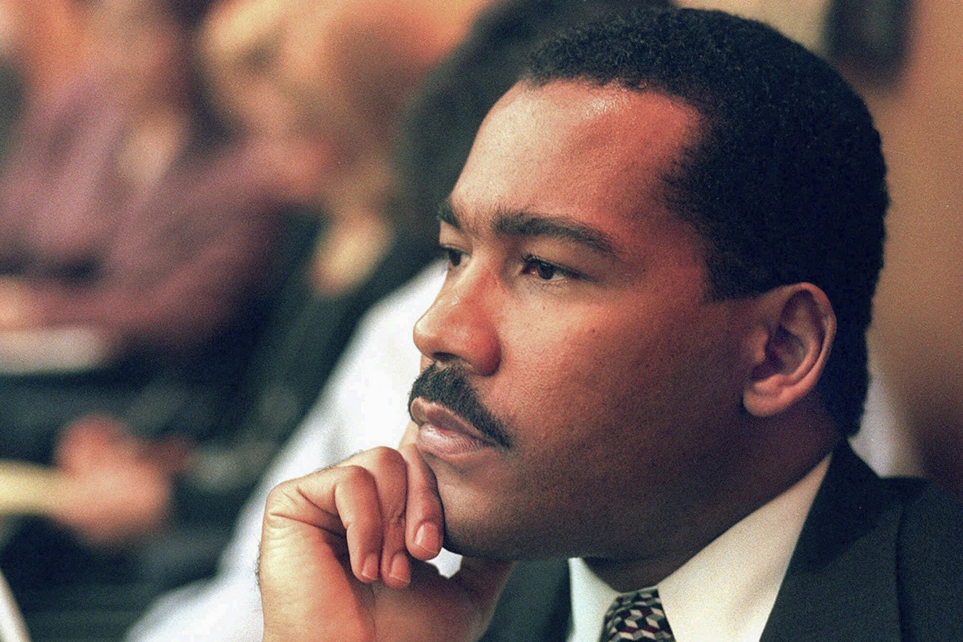 FILE - Dexter King, son of the late civil rights leader Martin Luther King Jr., listens to arguments in the State Court of Criminal Appeals in Jackson, Tenn., Aug. 29, 1997, to determine whether two Memphis judges have overstepped their authority surrounding the investigation of the King assassination. (Helen Comer/The Jackson Sun via AP, Pool, File)