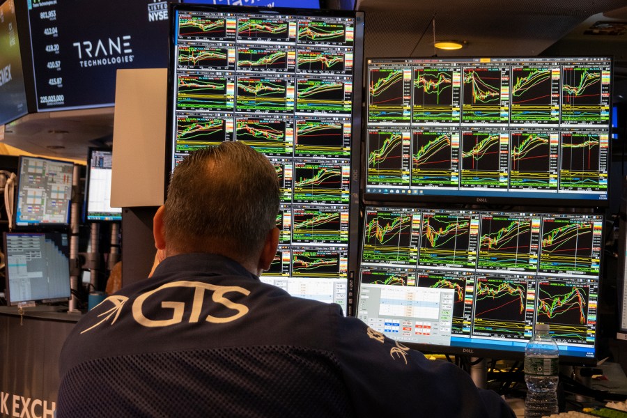 FILE - A specialist studies monitors on the New York Stock Exchange trading floor in New York on November 21, 2024. (AP Photo/Ted Shaffrey, File)