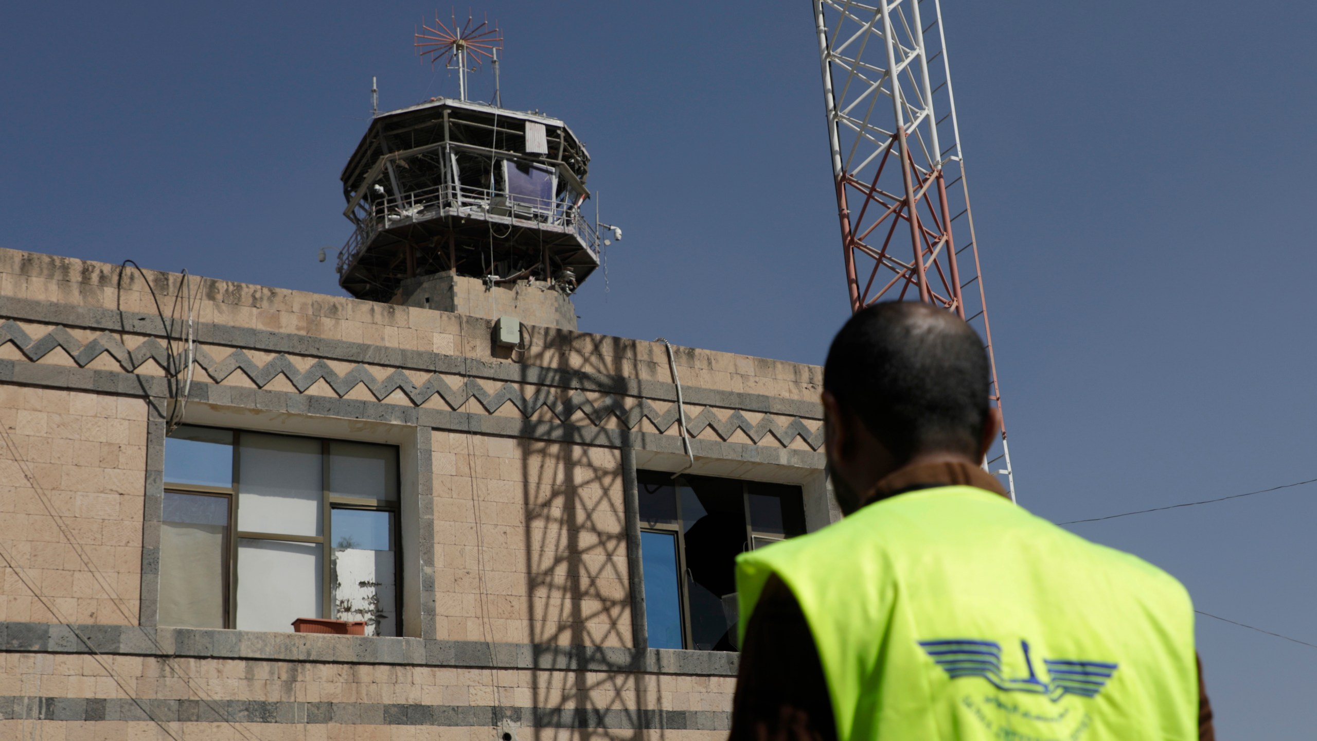 A man looks at the damage in the control tower of Sana'a International Airport following Thursday's Israeli airstrikes on Yemen, Friday, Dec. 27, 2024. The Israeli military reported targeting infrastructure used by the Houthis at the Sanaa International Airport, as well as ports in Hodeida, Al-Salif, and Ras Qantib, along with power stations Thursday Dec. 26..(AP Photo/Osamah Abdulrahman)