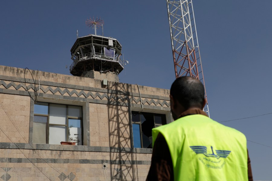 A man looks at the damage in the control tower of Sana'a International Airport following Thursday's Israeli airstrikes on Yemen, Friday, Dec. 27, 2024. The Israeli military reported targeting infrastructure used by the Houthis at the Sanaa International Airport, as well as ports in Hodeida, Al-Salif, and Ras Qantib, along with power stations Thursday Dec. 26..(AP Photo/Osamah Abdulrahman)