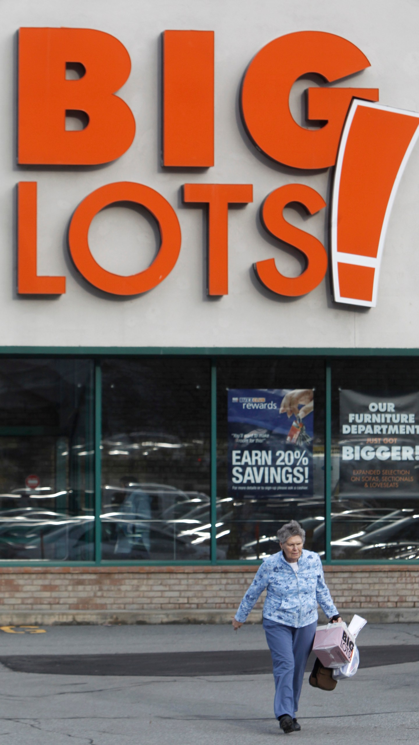 FILE - A shopper leaves the Big Lots store on Dec. 4, 2012 in Berlin, Vt. (AP Photo/Toby Talbot, File)