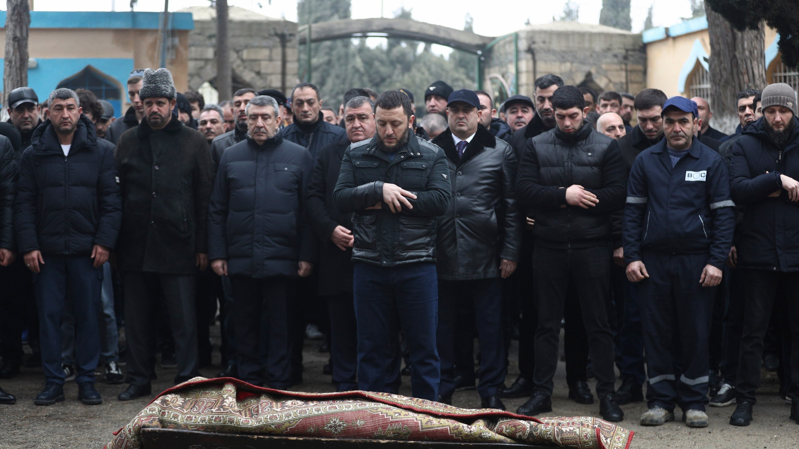 People attend a funeral of Mahammadali Eganov, 13 who died in the Azerbaijan Airlines Embraer 190 crash near Kazakhstan's Aktau airport, in Baku, Azerbaijan, Saturday, Dec. 28, 2024. (AP Photo)