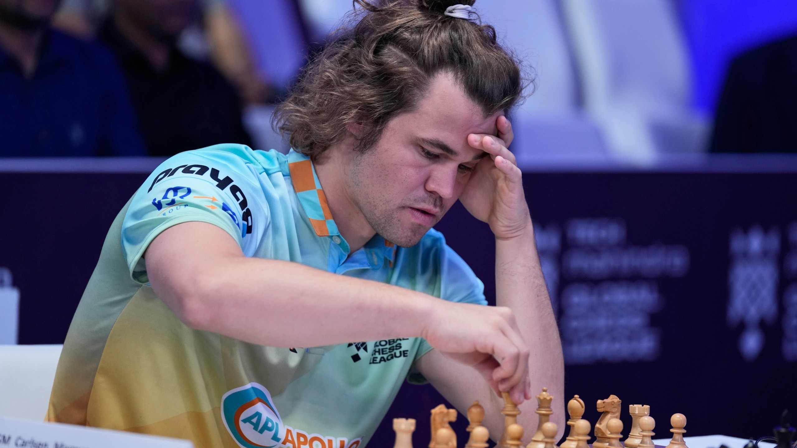 FILE - Norwegian Magnus Carlsen of SG Alpine Warriors plays against Poland's Jan-Krzysztof Duda of Chingari Gulf Titans during Global Chess League, July 1, 2023, in Dubai. (AP Photo/Kamran Jebreili, File)