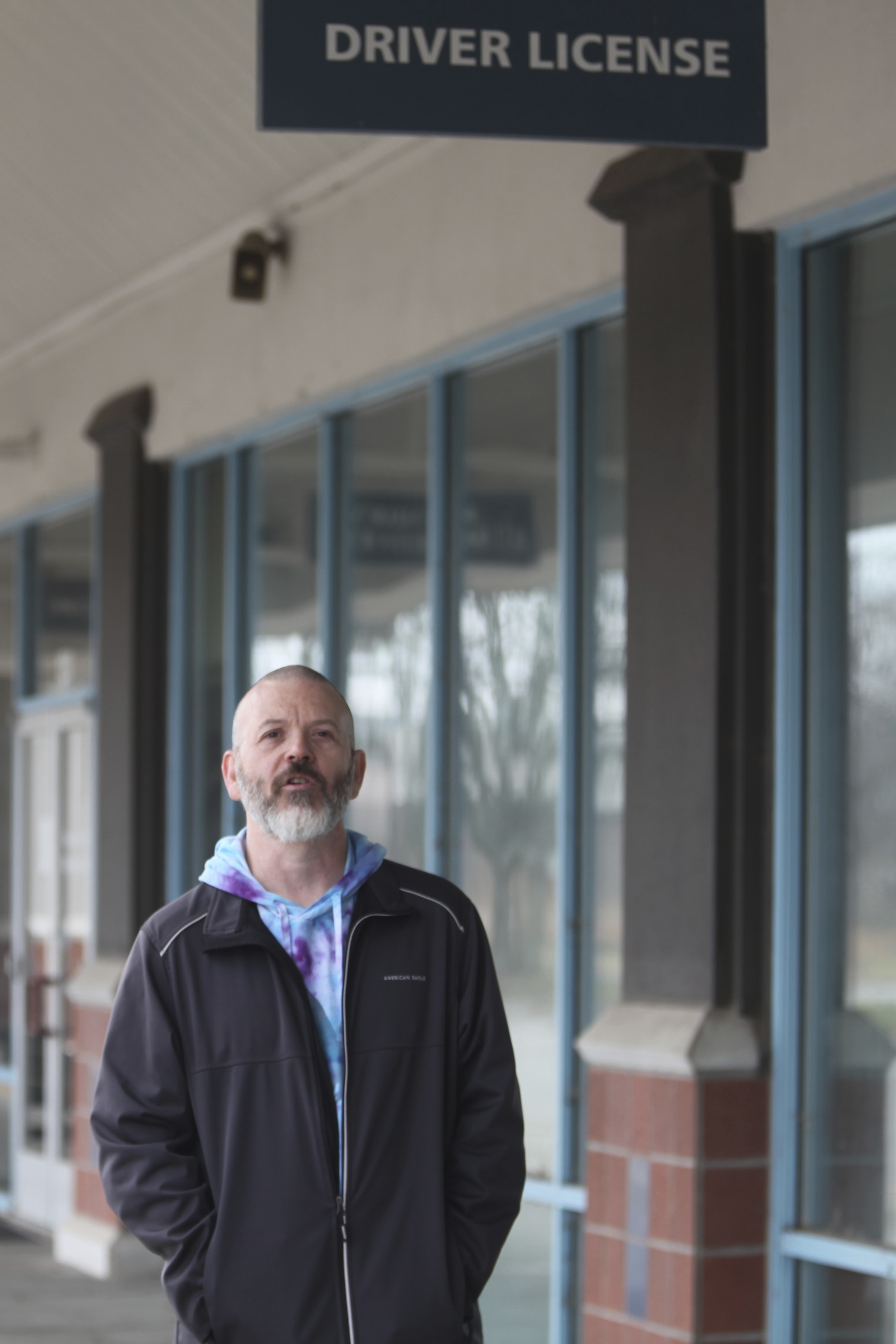 Steven Fish, of Garnett, Kan., visits the strip mall where he was unable to register to vote because of a proof-of-citizenship law that was later struck down by the federal courts, Monday, Dec. 9, 2024, in Lawrence, Kan. (AP Photo/John Hanna)