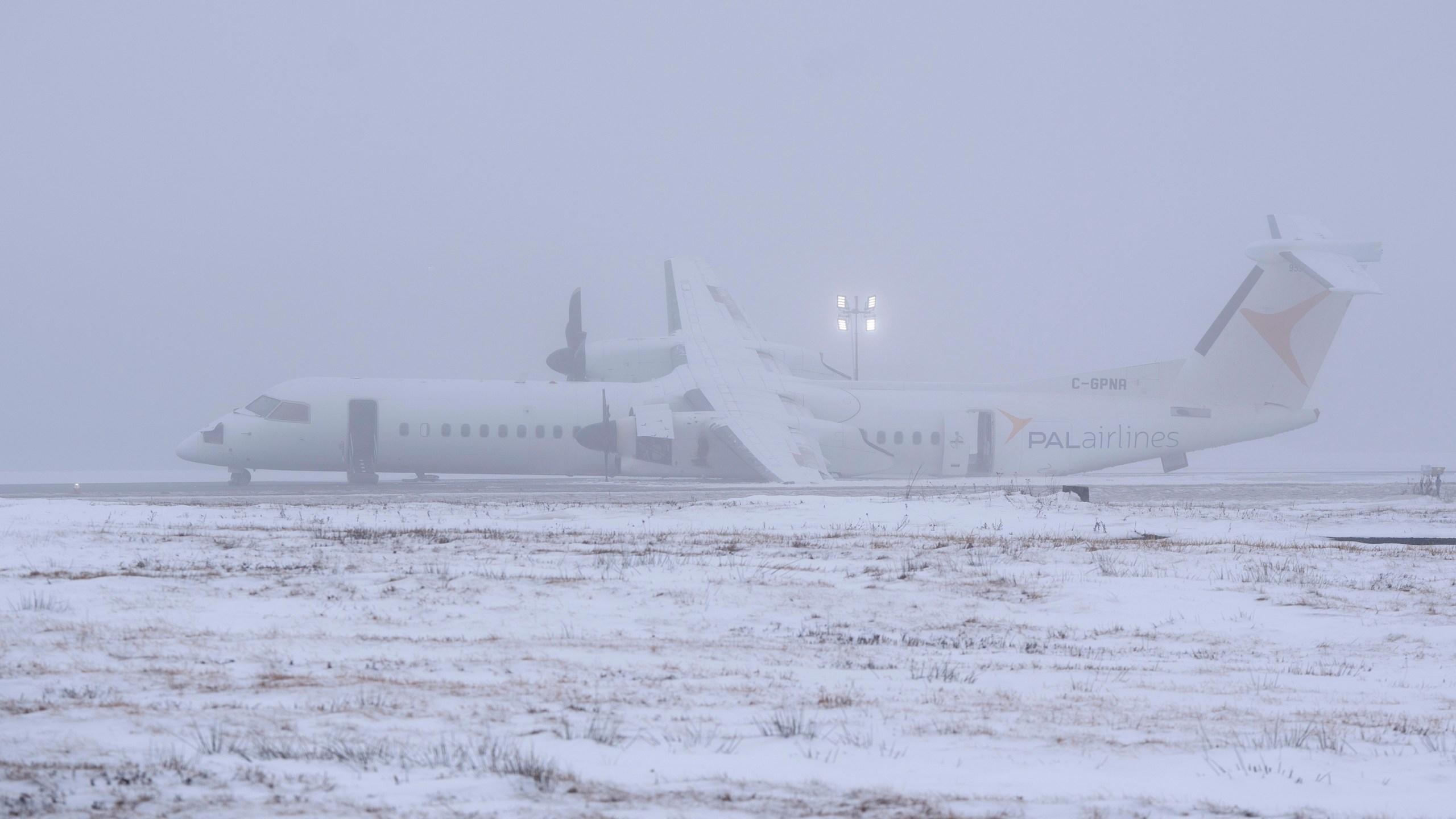 An Air Canada Express flight operated by Pal Airlines skidded off the runway Saturday night, after catching fire at Halifax Stanfield International Airport is seen on Sunday, Dec. 29, 2024, in Halifax, Nova Scotia. (Darren Calabrese/The Canadian Press via AP)