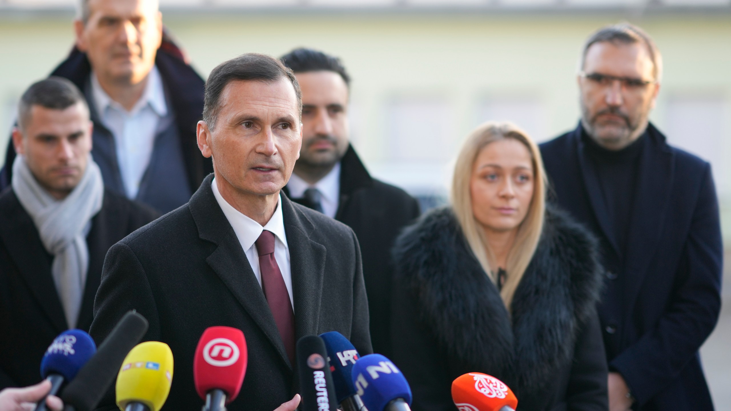 Dragan Primorac, the candidate of the ruling Croatian Democratic Union (HDZ) speaks to the media after casting his ballot during a presidential election at a polling station in Zagreb, Croatia, Sunday, Dec. 29, 2024. (AP Photo/Darko Bandic)