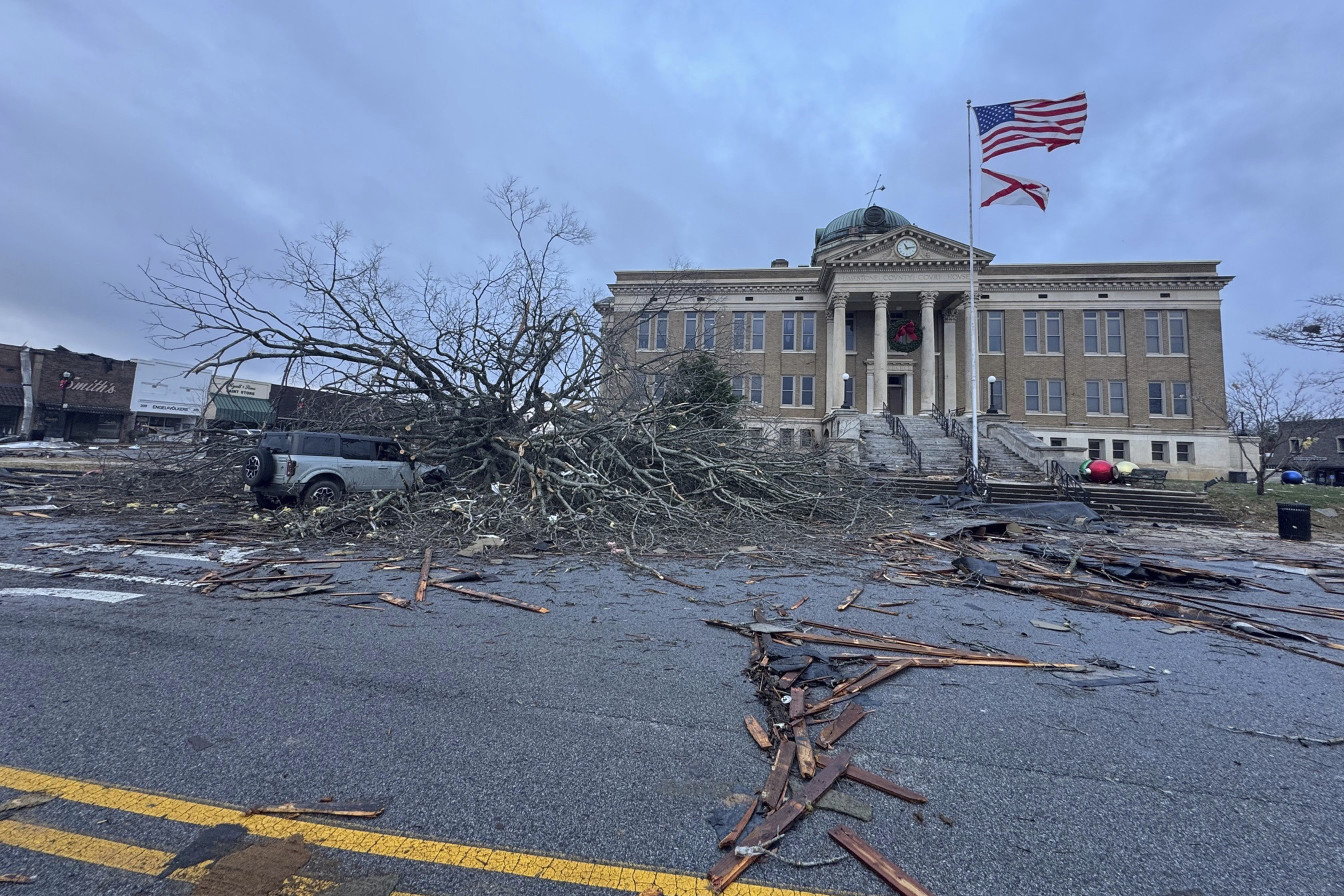 Damage from a storm through that rolled through the night before is seen at the heart of downtown on Sunday, Dec. 29, 2024, in Athens, Ala. (AP Photo/Lance George)