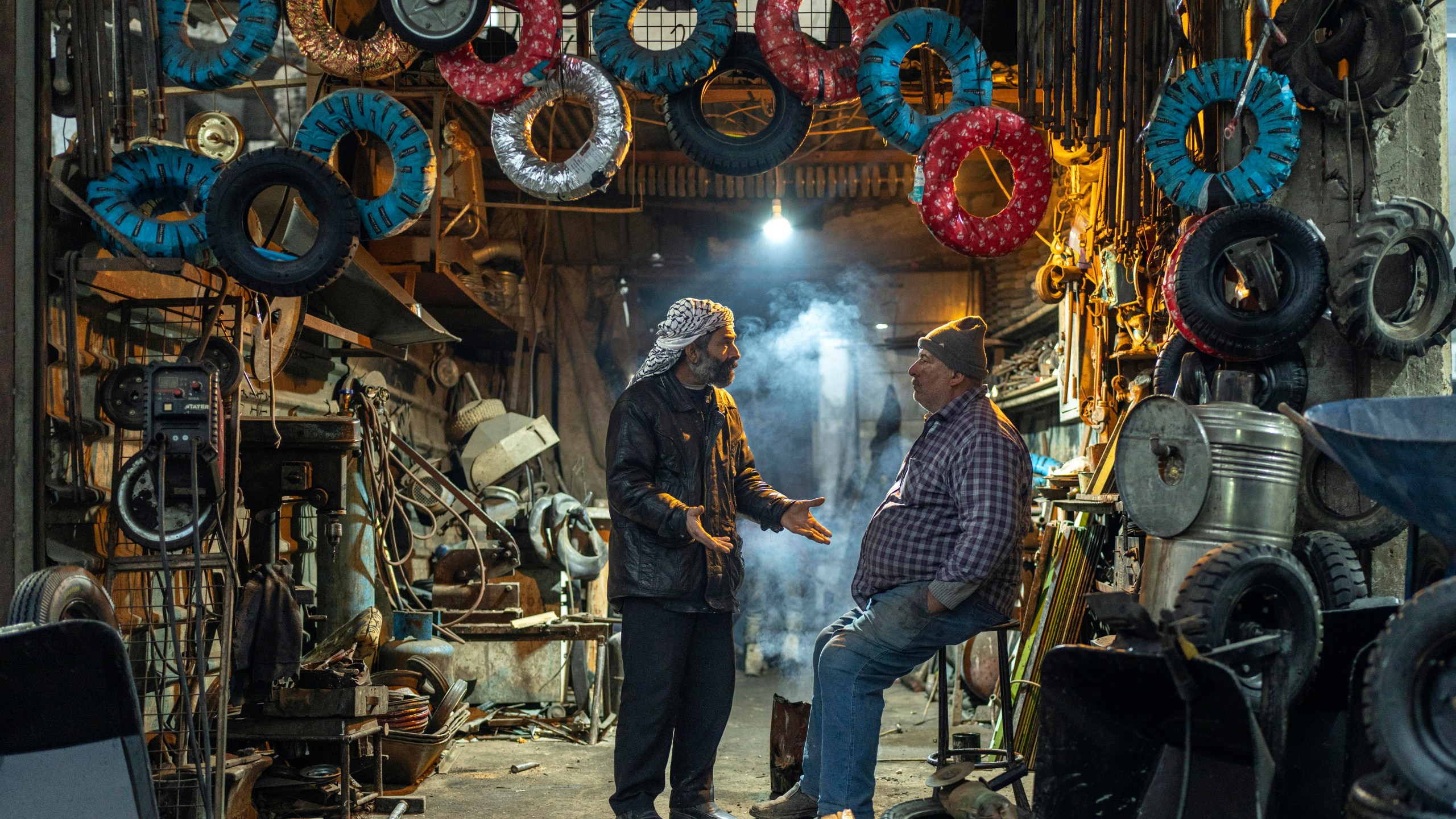 Wokers at a tyre shop wait for customers in Douma, on the outskirts of Damascus, Syria, Sunday, Dec. 29, 2024 (AP Photo/Mosa'ab Elshamy)