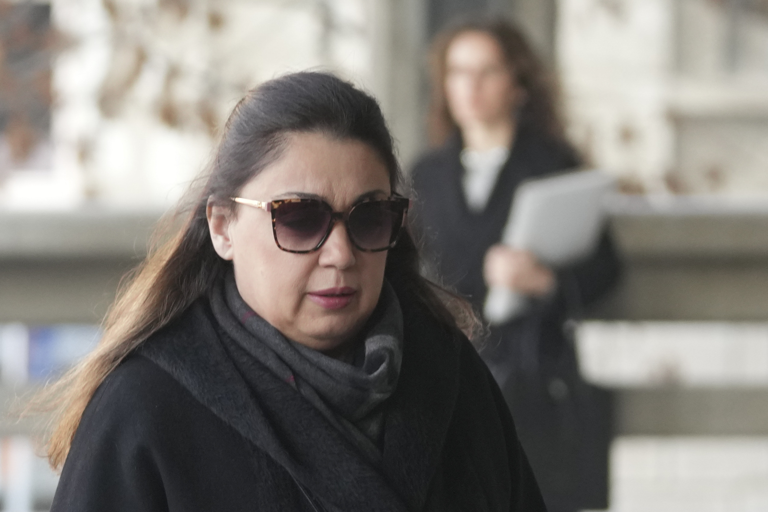 Miljana Kecmanovic, mother of of a boy who killed 9 students and security guard in school shooting in 2023, arrives in the court building prior to a verdict in trial, in Belgrade, Serbia, Monday, Dec. 30, 2024. (AP Photo/Darko Vojinovic)