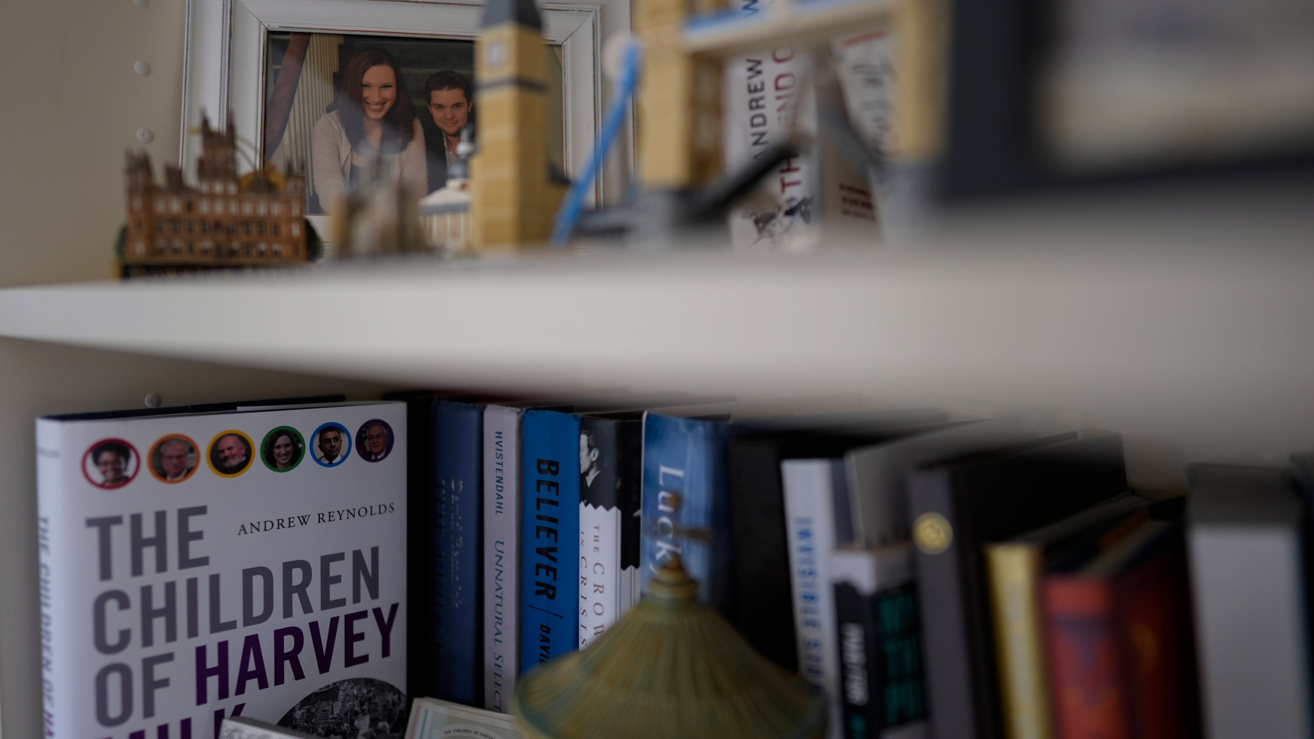 A photo of U.S.-Rep.-elect Sarah McBride, D-Del., with her husband Andy Cray is seen on a shelf in her Wilmington, Del., home, Wednesday, Dec. 18, 2024. Cray died from cancer in 2014. (AP Photo/Carolyn Kaster)