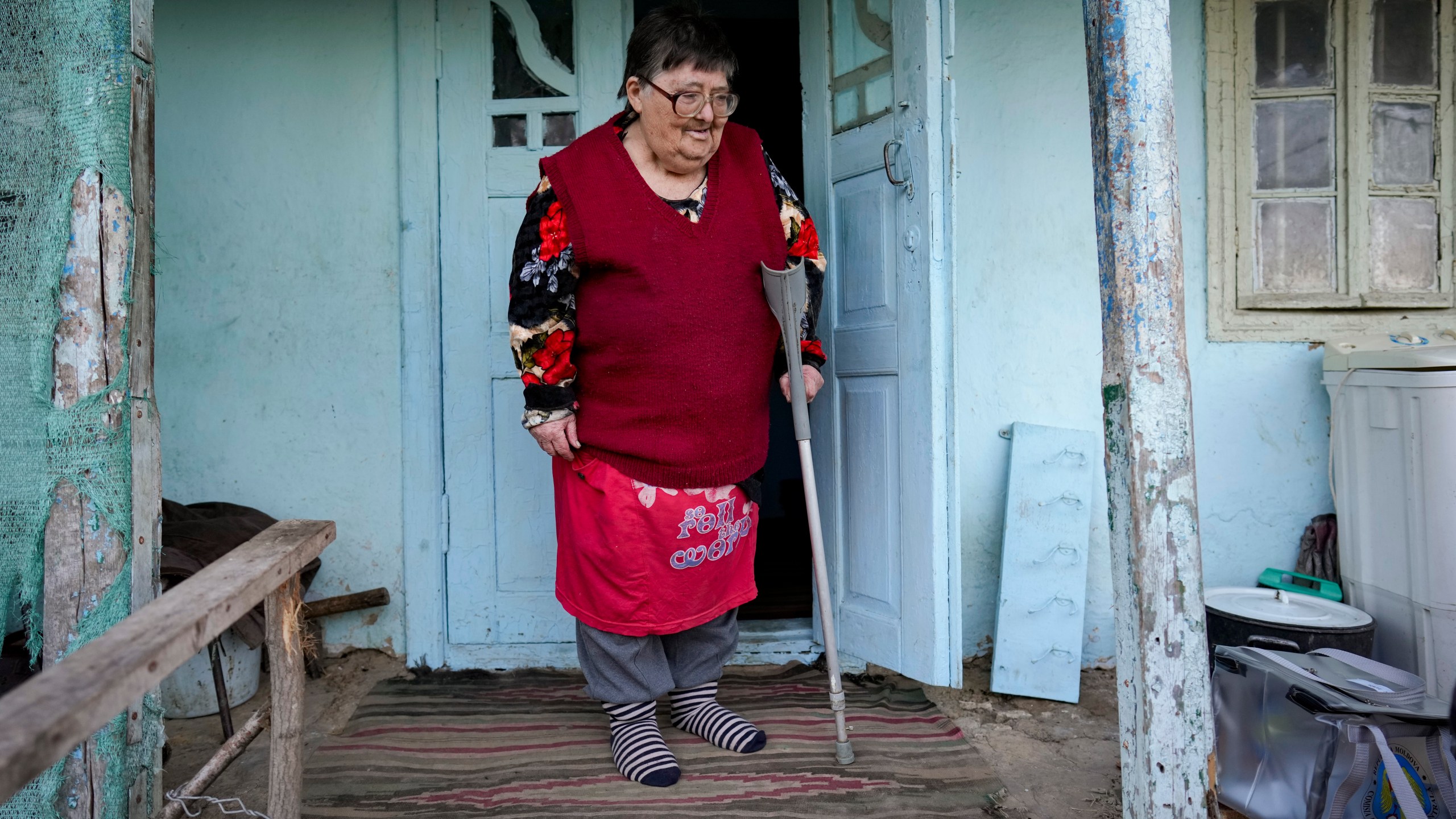 FILE - A woman looks at a mobile ballot box in the village of Ciopleni, Moldova, Sunday, Nov. 3, 2024. (AP Photo/Vadim Ghirda, File)