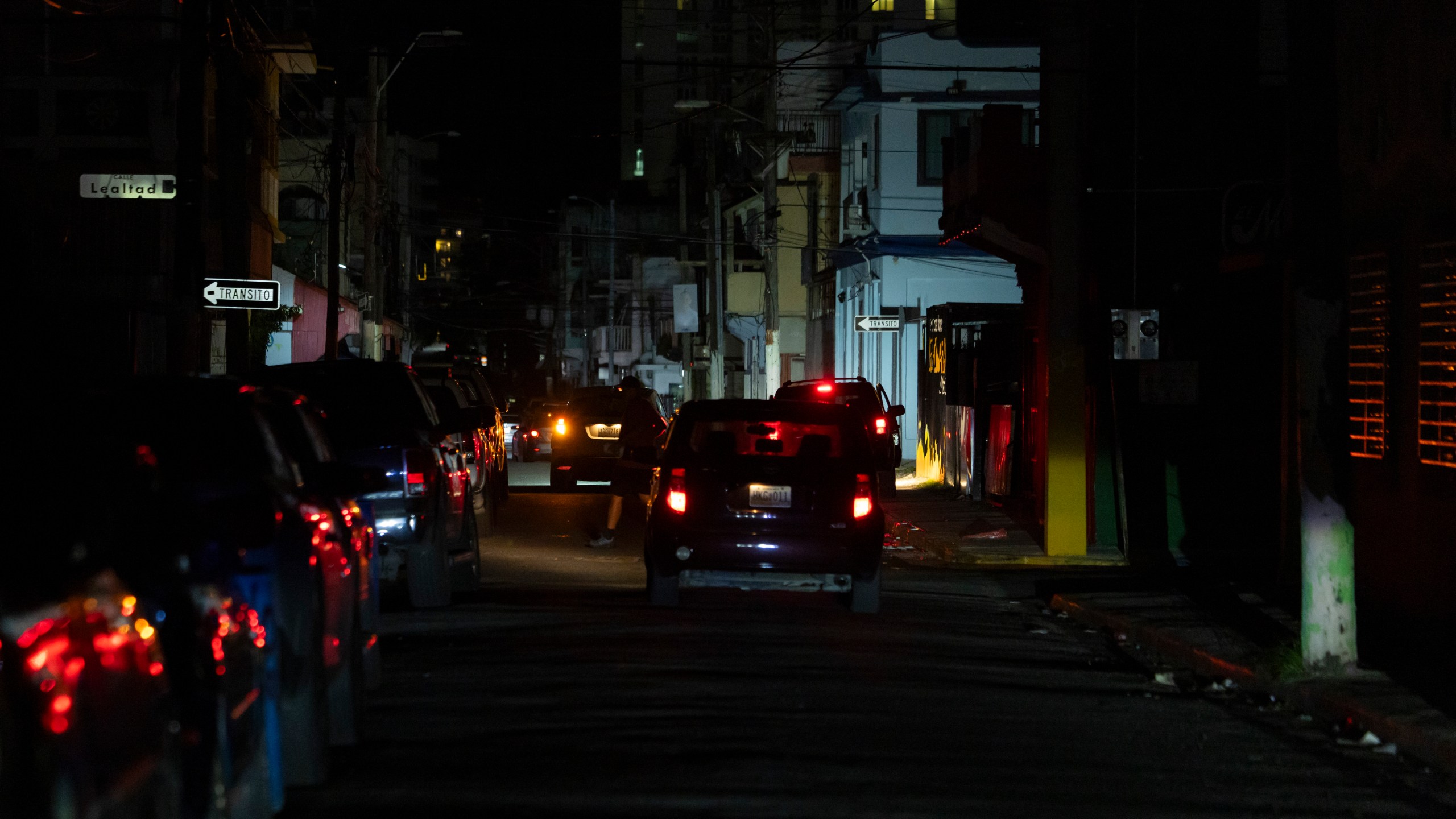 A street is dark during a blackout in San Juan, Puerto Rico, after sunset on Tuesday, Dec. 31, 2024. (AP Photo/Alejandro Granadillo)