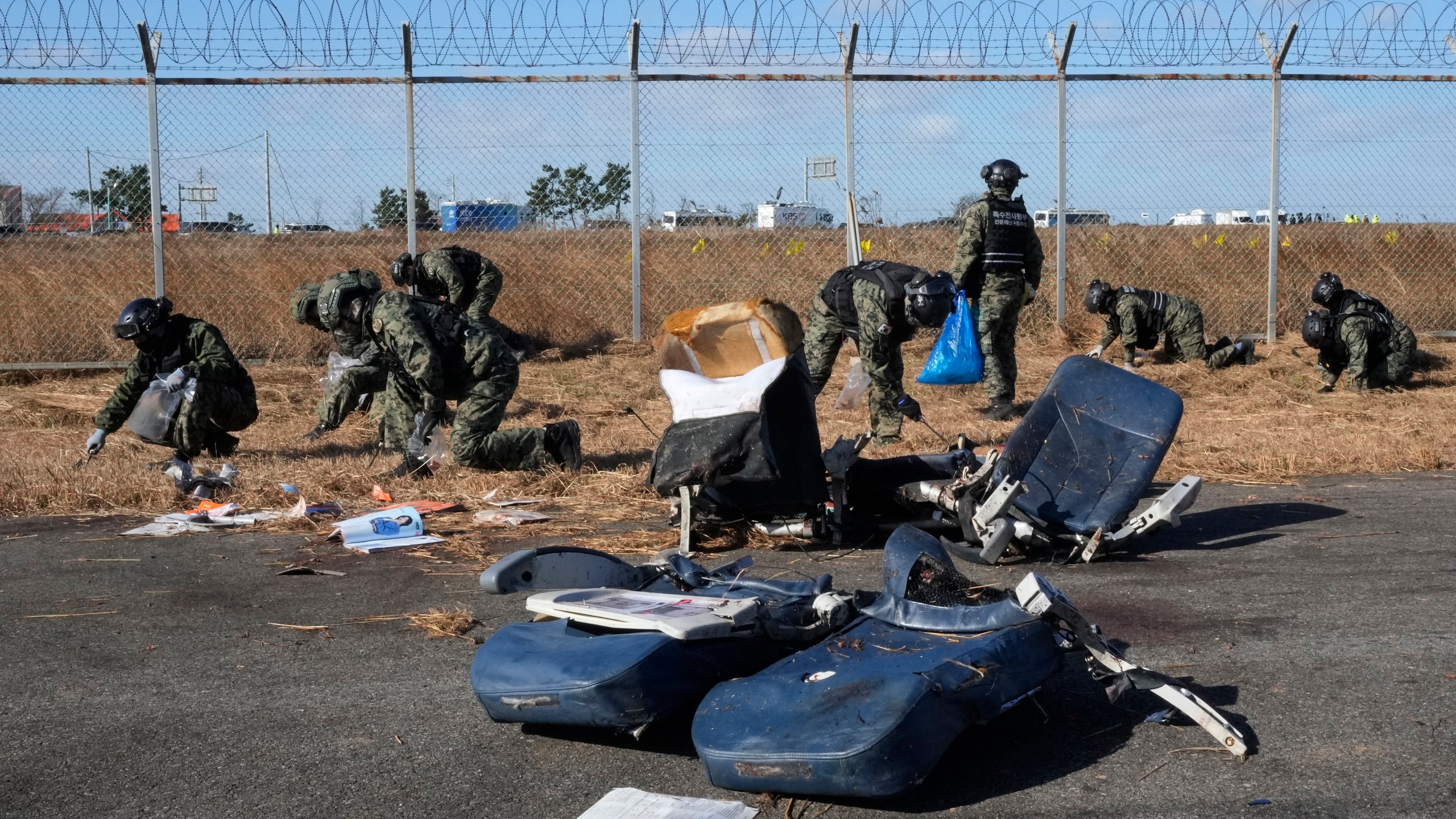 South Korean army soldiers work outside of Muan International Airport in Muan, South Korea, Tuesday, Dec. 31, 2024. (AP Photo/Ahn Young-joon)