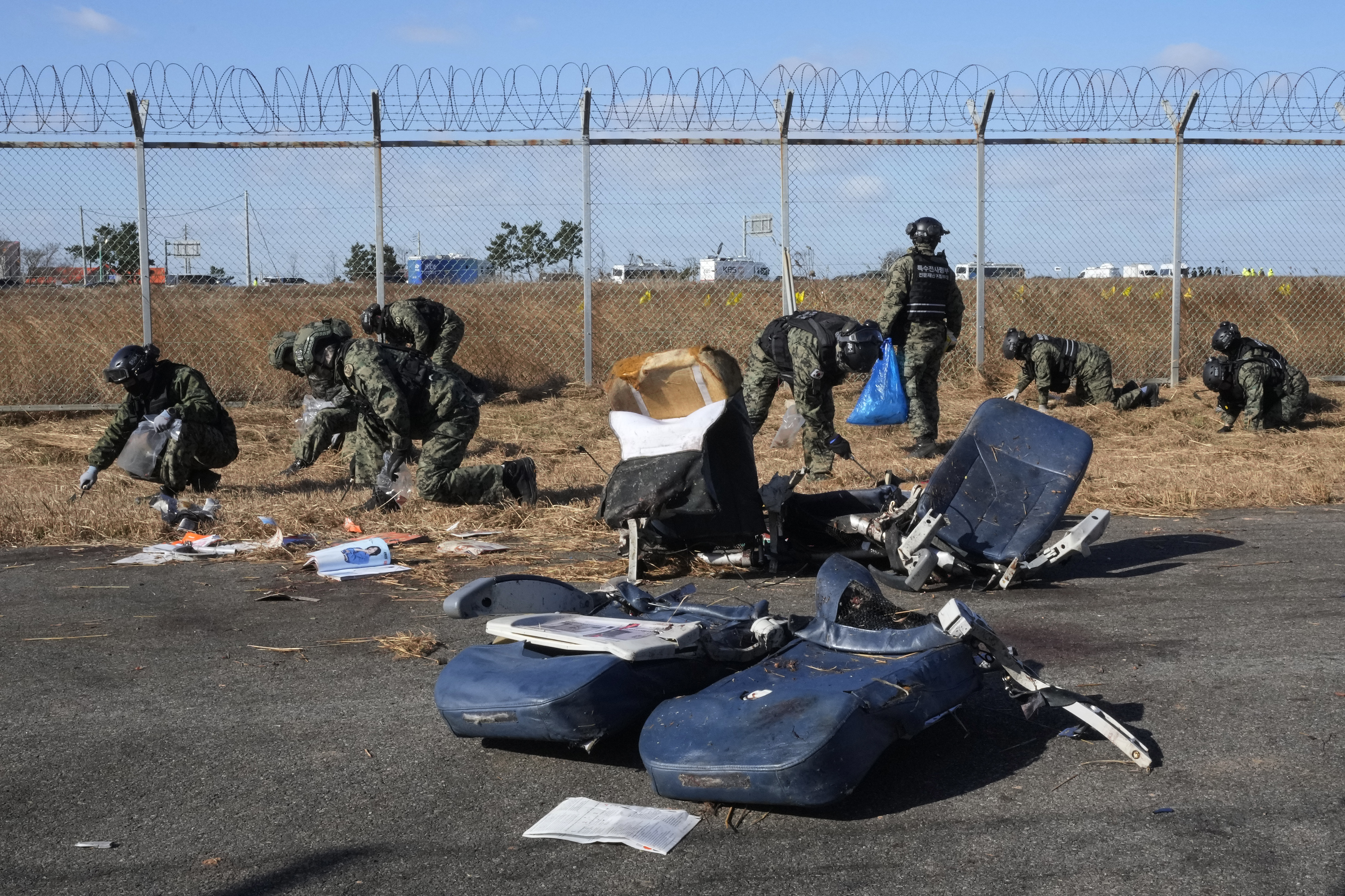 South Korean army soldiers work outside of Muan International Airport in Muan, South Korea, Tuesday, Dec. 31, 2024. (AP Photo/Ahn Young-joon)