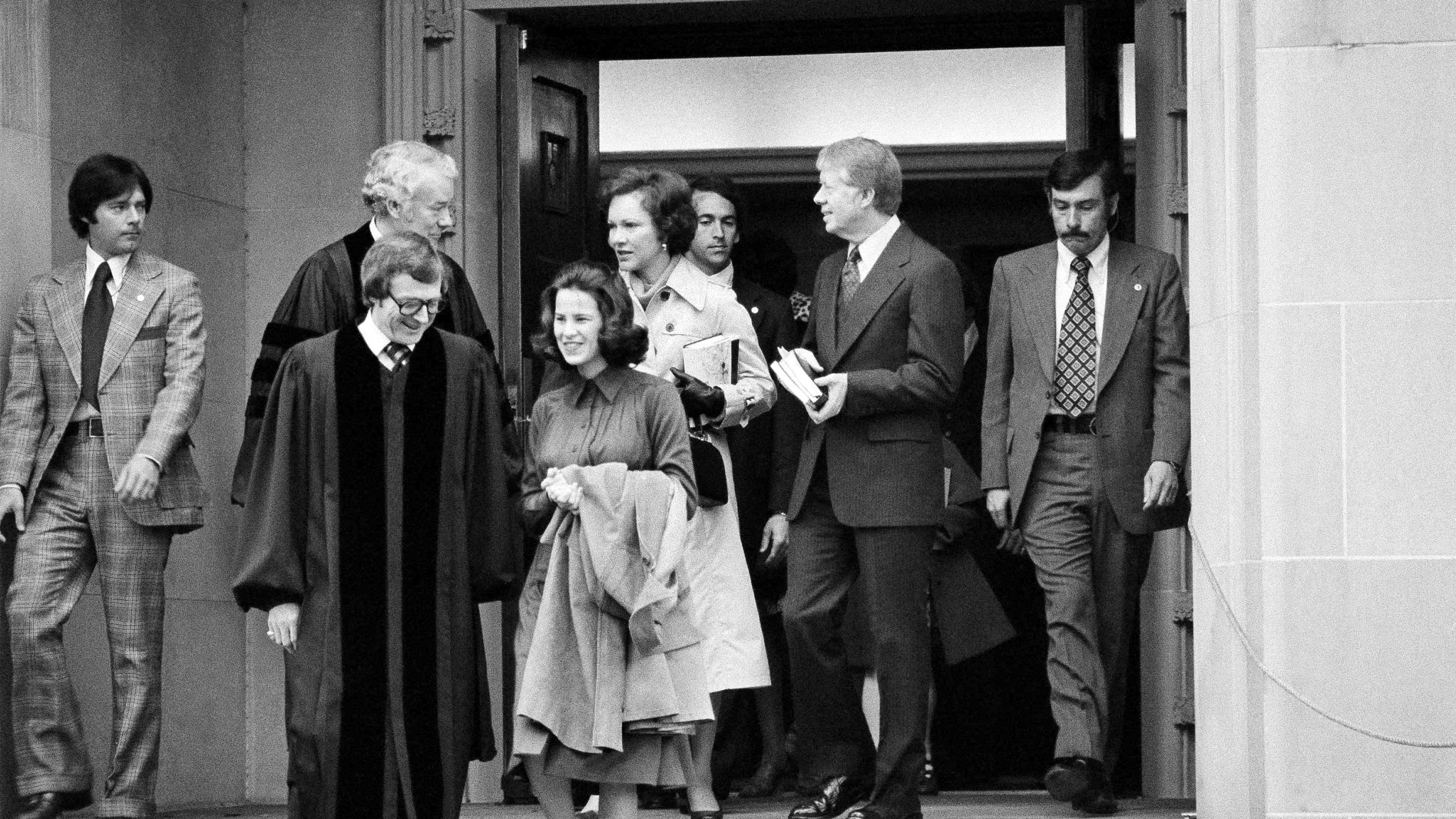 FILE - President Jimmy Carter and Rosalynn Carter chat with Rev. Charles Trentham as they leave the First Baptist Church in Washington on March 20, 1977. (AP Photo/Charles W. Harrity, File)