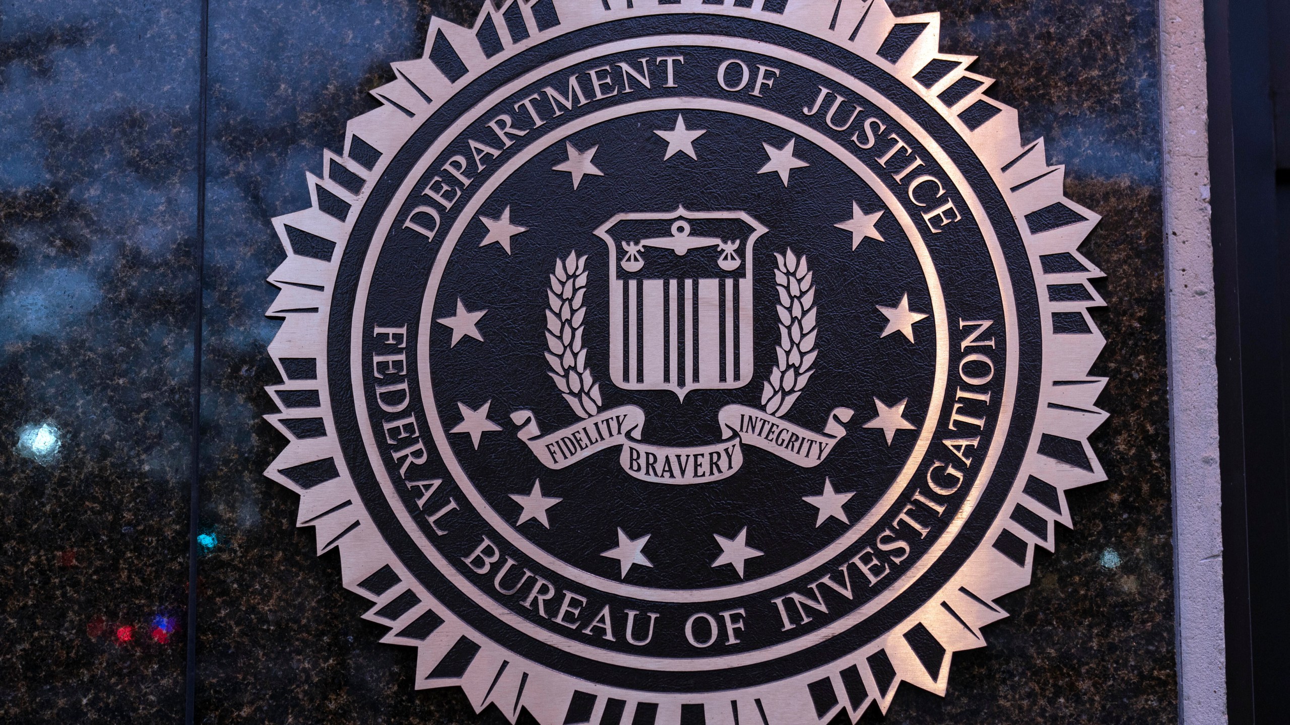 FILE - The seal of theFederal Bureau of Investigation (FBI) is seen on the Headquarters in Washington, Saturday, Dec. 7, 2024. (AP Photo/Jose Luis Magana, File)