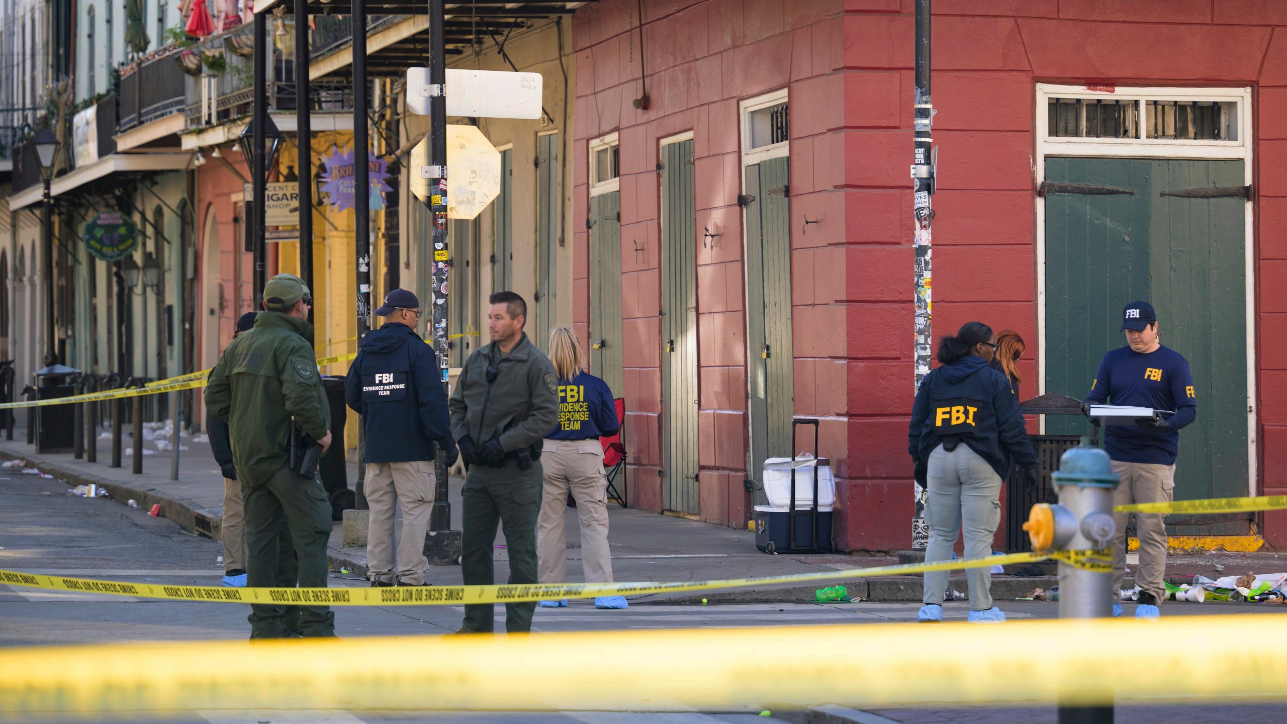 The FBI investigates the area on Orleans St and Bourbon Street by St. Louis Cathedral in the French Quarter where a suspicious package was detonated after a person drove a truck into a crowd earlier on Bourbon Street on Wednesday, Jan. 1, 2025. (AP Photo/Matthew Hinton)