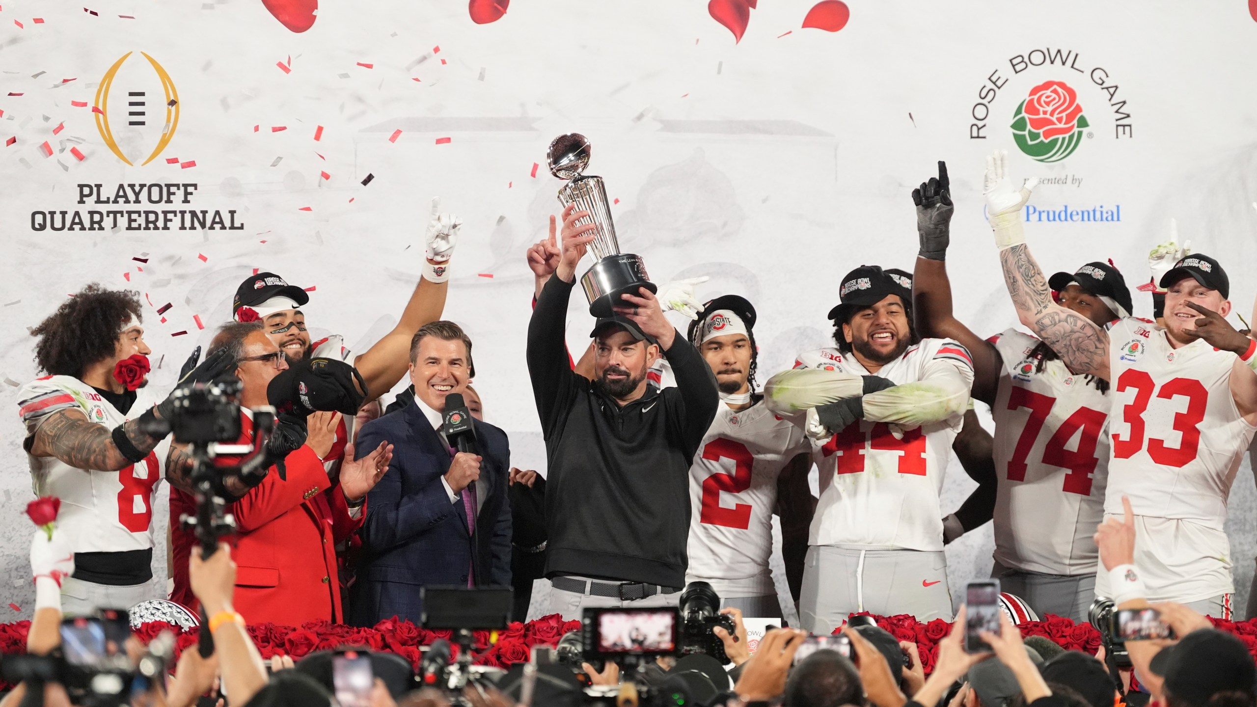 Ohio State head coach Ryan Day celebrates with the trophy alongside his team after winning the Rose Bowl College Football Playoff against Oregon, Wednesday, Jan. 1, 2025, in Pasadena, Calif. (AP Photo/Mark J. Terrill)