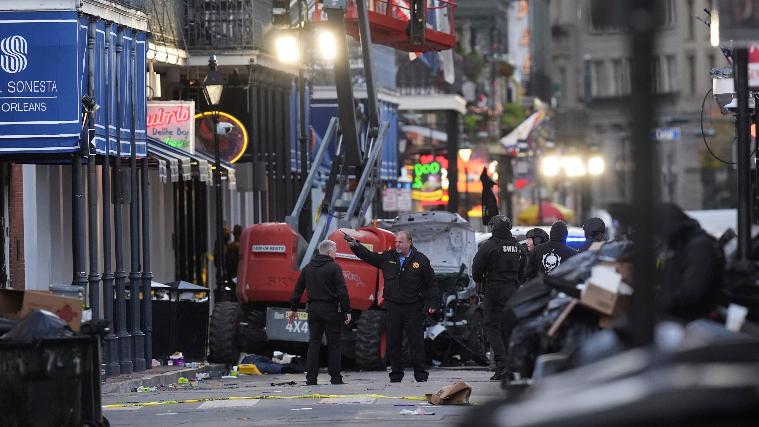 EDS NOTE: GRAPHIC CONTENT - Emergency personnel work the scene on Bourbon Street after a vehicle drove into a crowd on New Orleans' Canal and Bourbon Street, Wednesday Jan. 1, 2025. (AP Photo/Gerald Herbert)