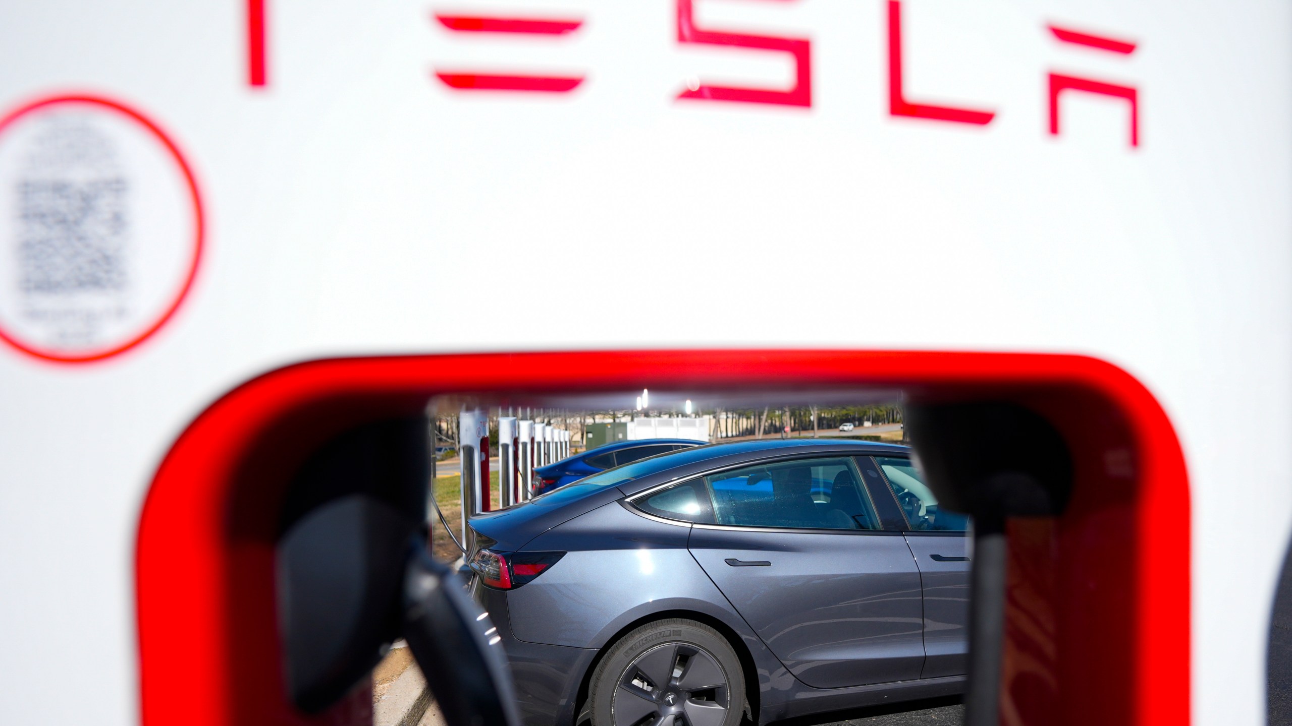 FILE - A Tesla level three Electric vehicle charger is visible, Feb. 2, 2024, in Kennesaw, Ga., near Atlanta. (AP Photo/Mike Stewart, File)