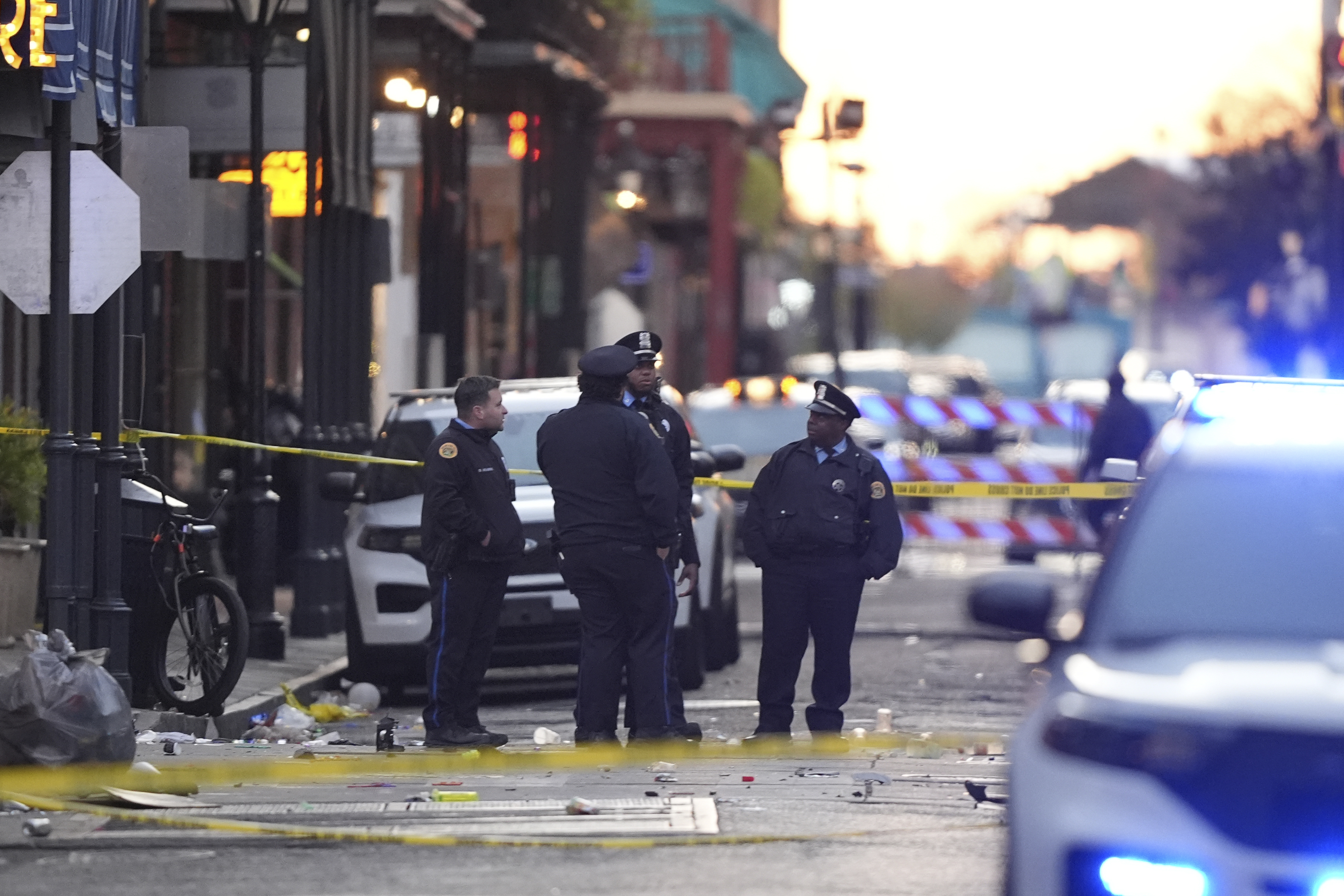 Emergency services attend the scene on Bourbon Street after a vehicle drove into a crowd on New Orleans' Canal and Bourbon Street, Wednesday Jan. 1, 2025. (AP Photo/Gerald Herbert)