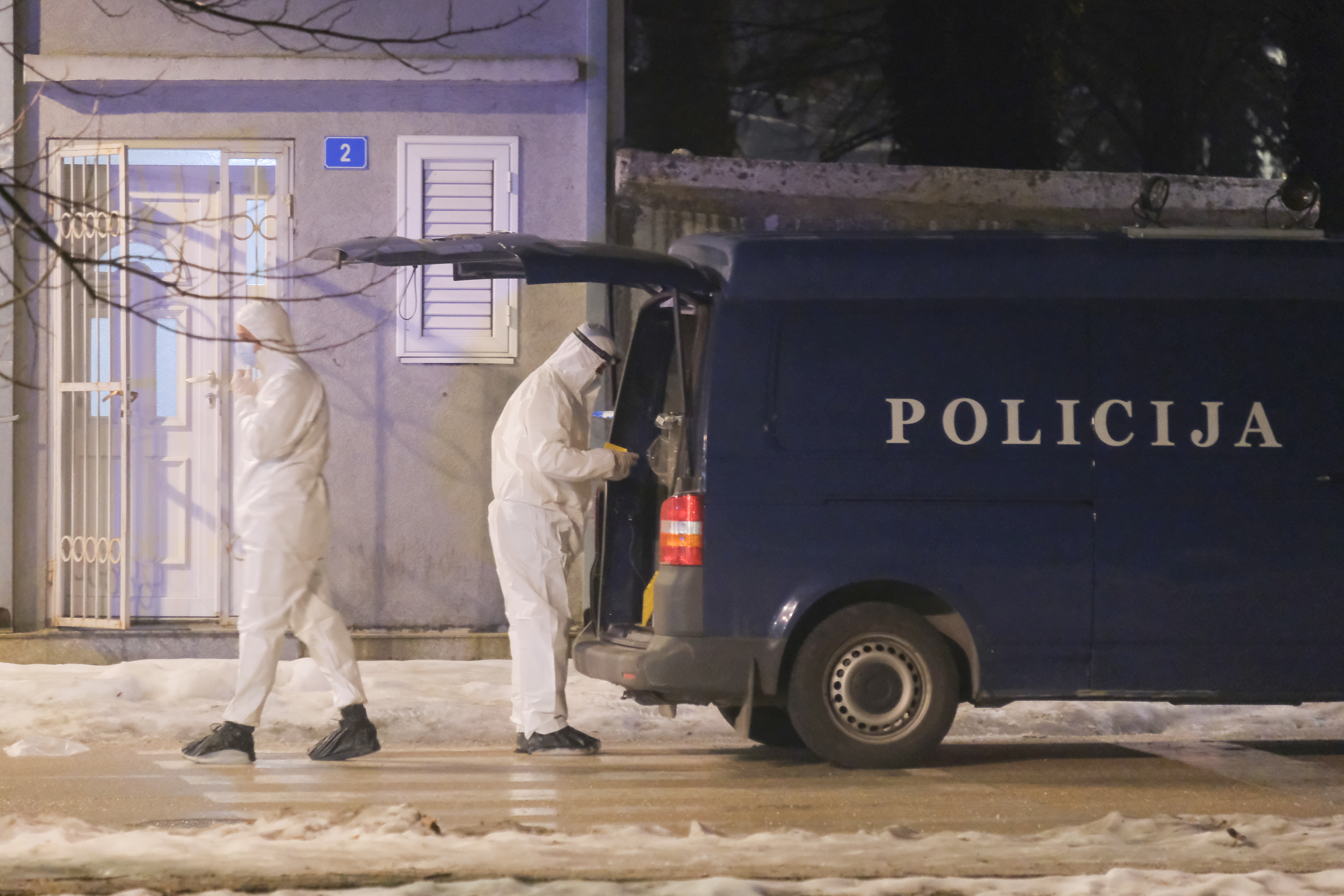 Police investigators work at the site of a shooting in Cetinje, 36 kilometers (22 miles) west of Podogrica, Montenegro, Wednesday, Jan 1, 2025. (AP Photo/Risto Bozovic)