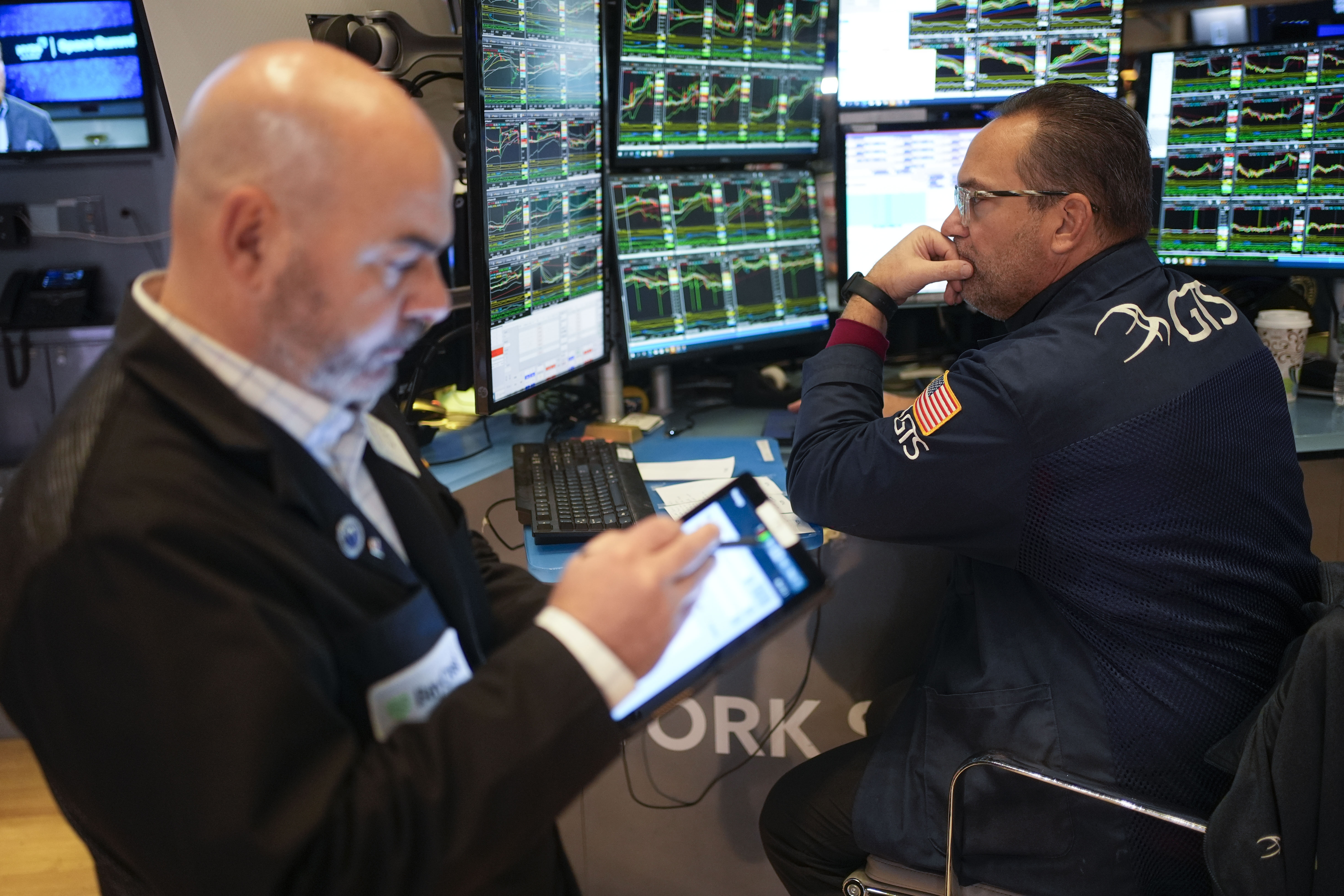 Traders work on the floor at the New York Stock Exchange in New York's Financial District Thursday, Jan. 2, 2025. (AP Photo/Seth Wenig)