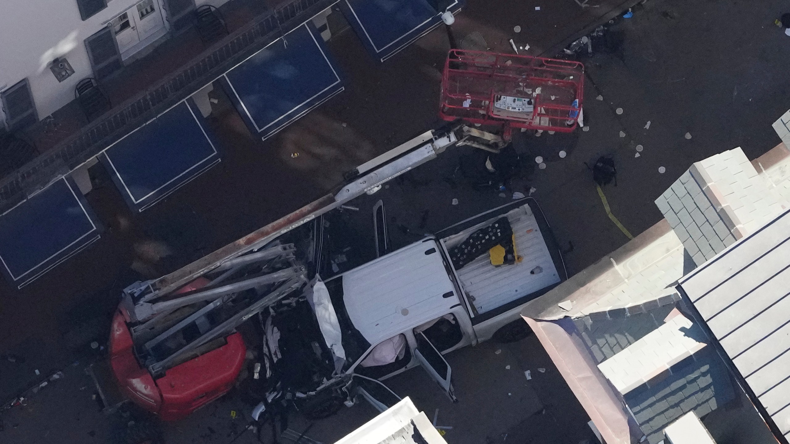 Investigators work the scene after a person drove a vehicle into a crowd earlier on Canal and Bourbon Street in New Orleans, Wednesday, Jan. 1, 2025. (AP Photo/Gerald Herbert)