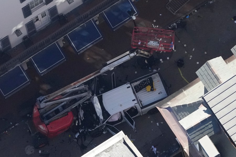 Investigators work the scene after a person drove a vehicle into a crowd earlier on Canal and Bourbon Street in New Orleans, Wednesday, Jan. 1, 2025. (AP Photo/Gerald Herbert)