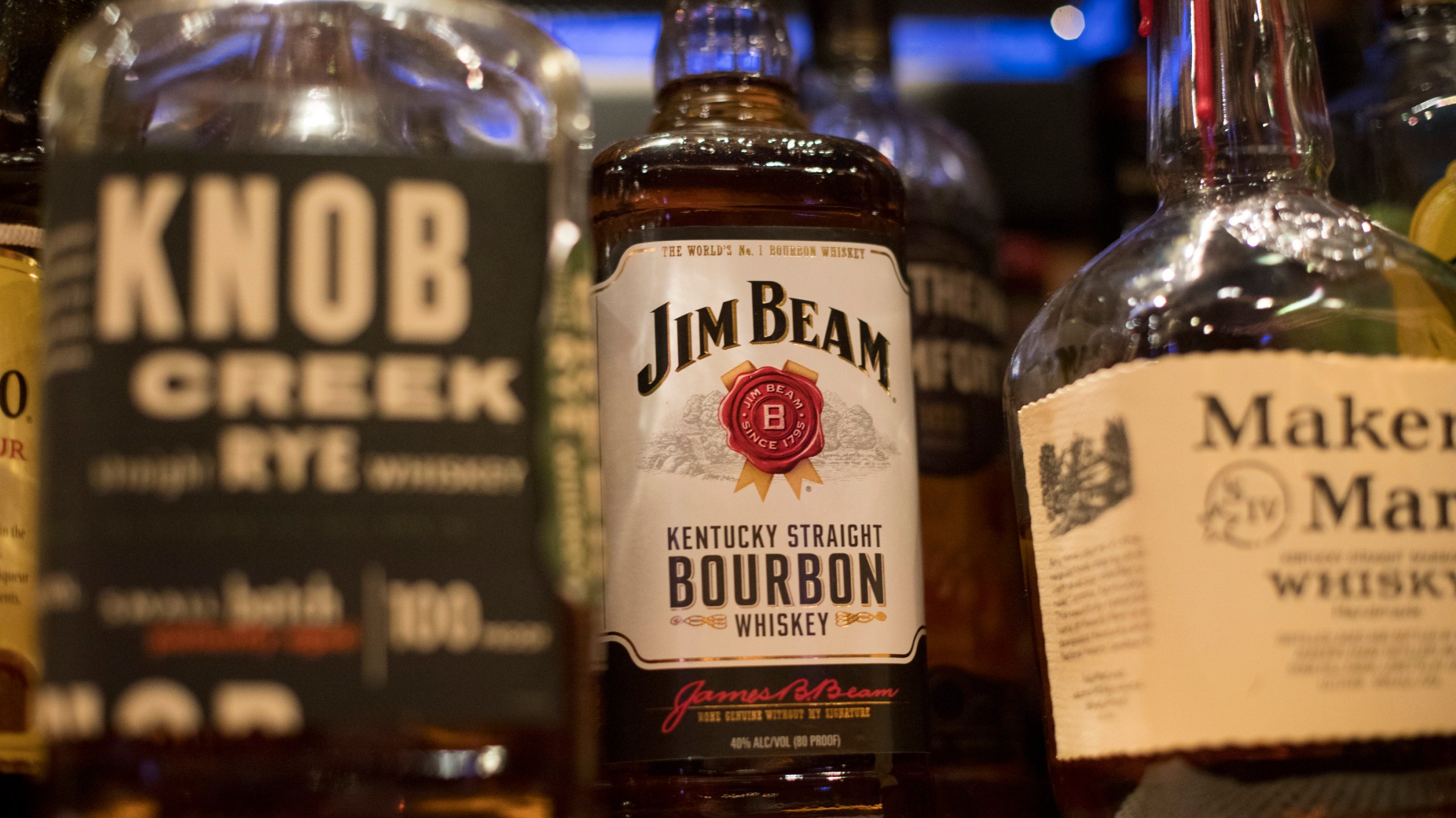 FILE - Jim Beam, Knob Creek and other alcohol bottles are pictured at a bar in Eagle, Colo., Dec. 25, 2018. (AP Photo/Jenny Kane, File)