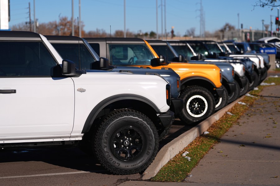 FILE - A long line of unsold 2024 Bronco utility vehicles sit on display at Ford dealership on Nov. 28, 2024, in southeast Denver. (AP Photo/David Zalubowski, File)