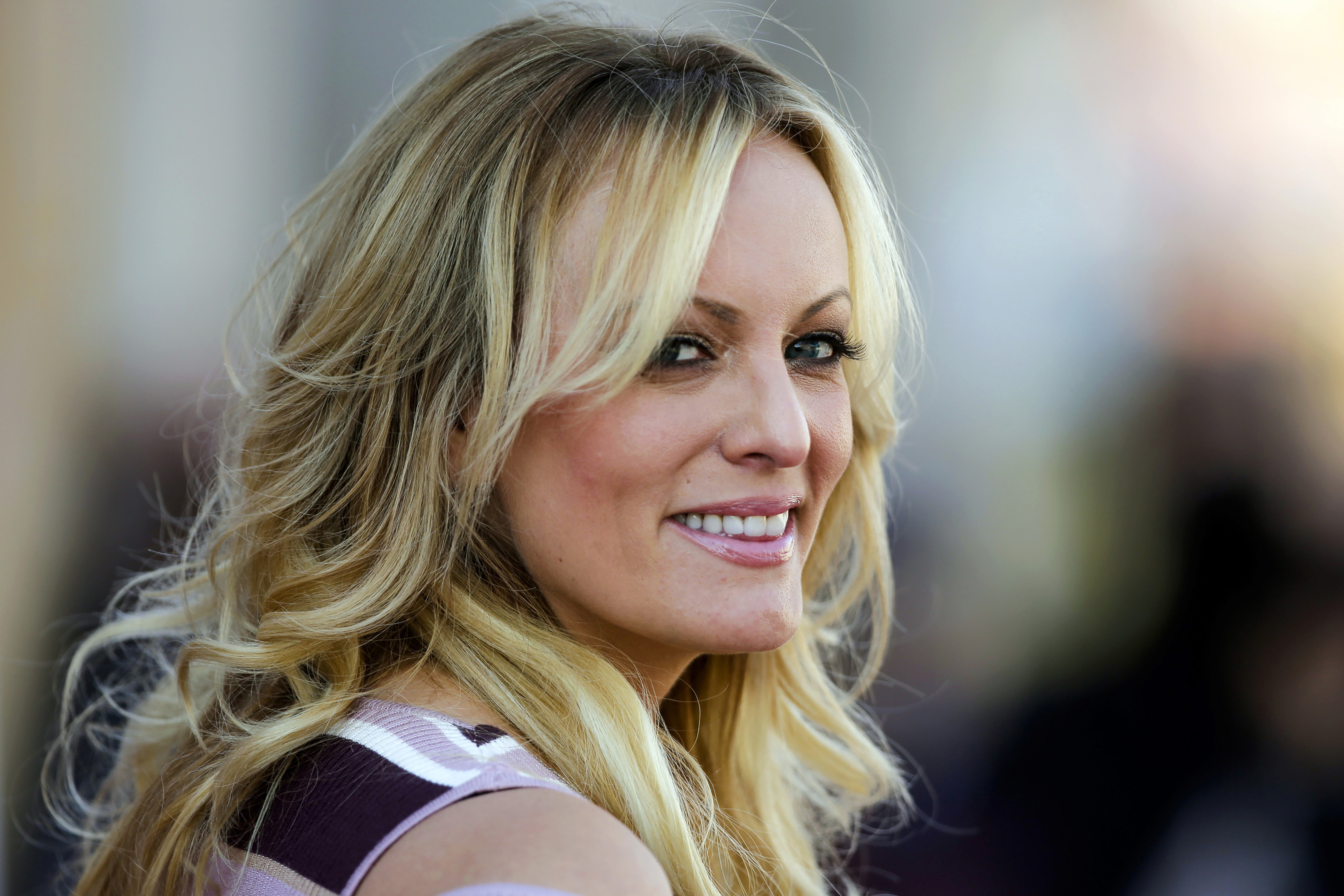 FILE — Adult film actress Stormy Daniels attends the opening of the adult entertainment fair "Venus," in Berlin, Oct. 11, 2018. (AP Photo/Markus Schreiber, File)