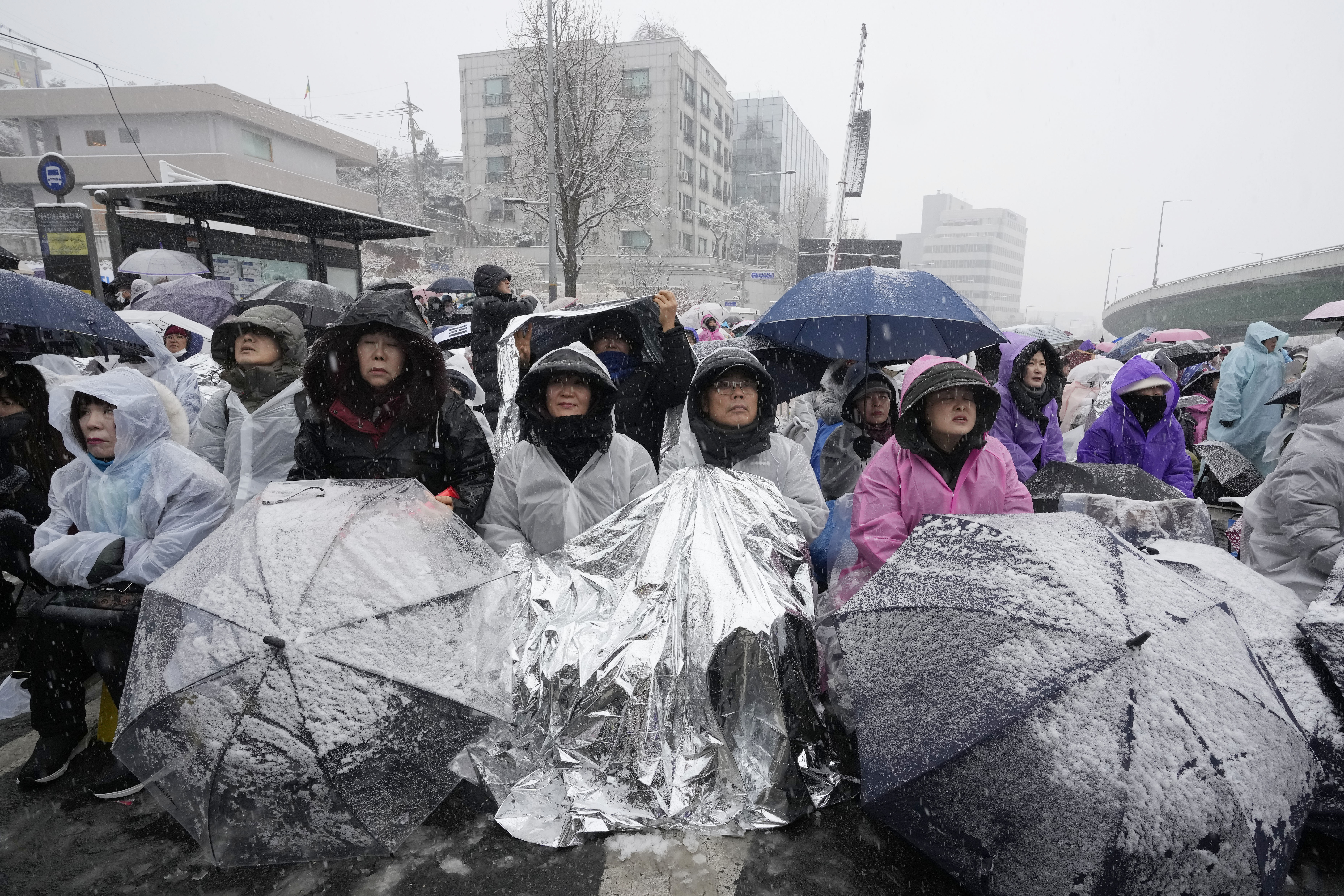 Supporters of impeached South Korean President Yoon Suk Yeol attend a Sunday service as they gather to oppose his impeachment near the presidential residence in Seoul, South Korea, Sunday, Jan. 5, 2025. (AP Photo/Ahn Young-joon)