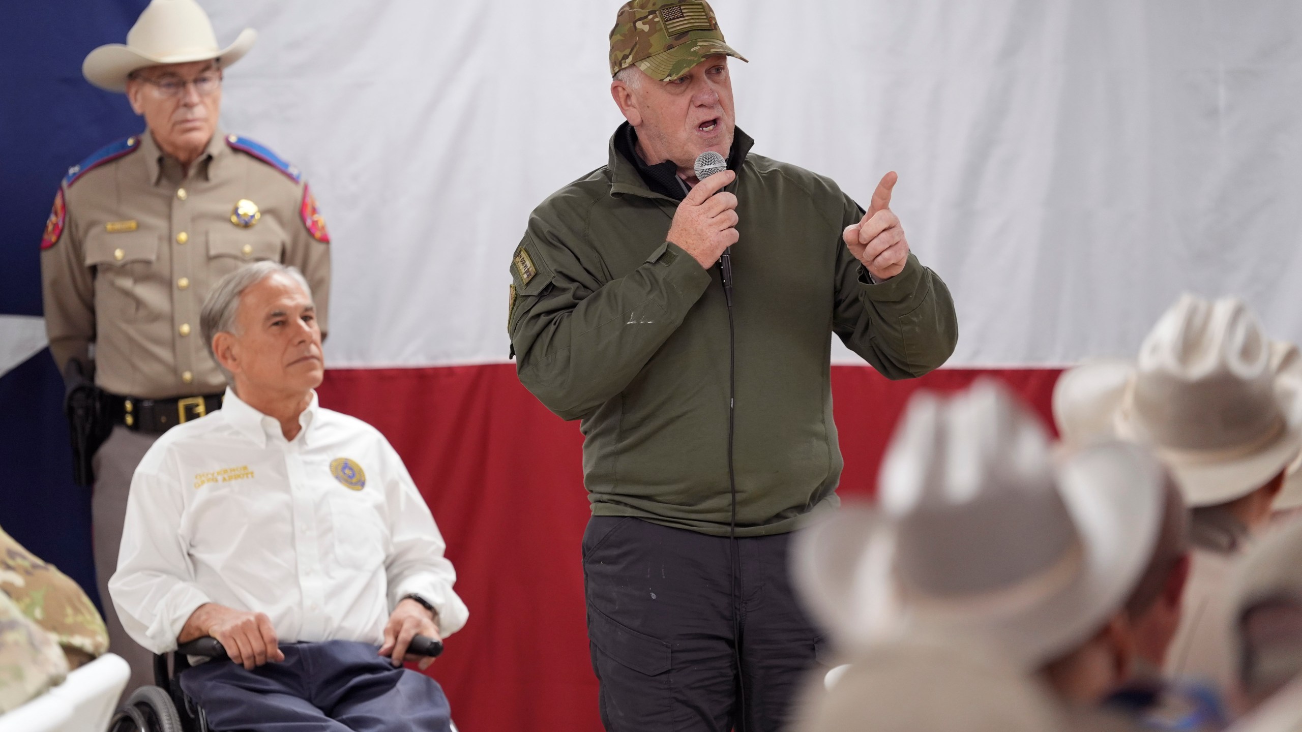 FILE - Incoming U.S. Border Czar Tom Homan, right, stands with Texas Gov. Greg Abbott, left, as he makes statements before serving meals to state troopers and national guardsmen taking part in Operation Lone Star at a facility on the U.S.-Mexico border on Nov. 26, 2024, in Eagle Pass, Texas. (AP Photo/Eric Gay, File)