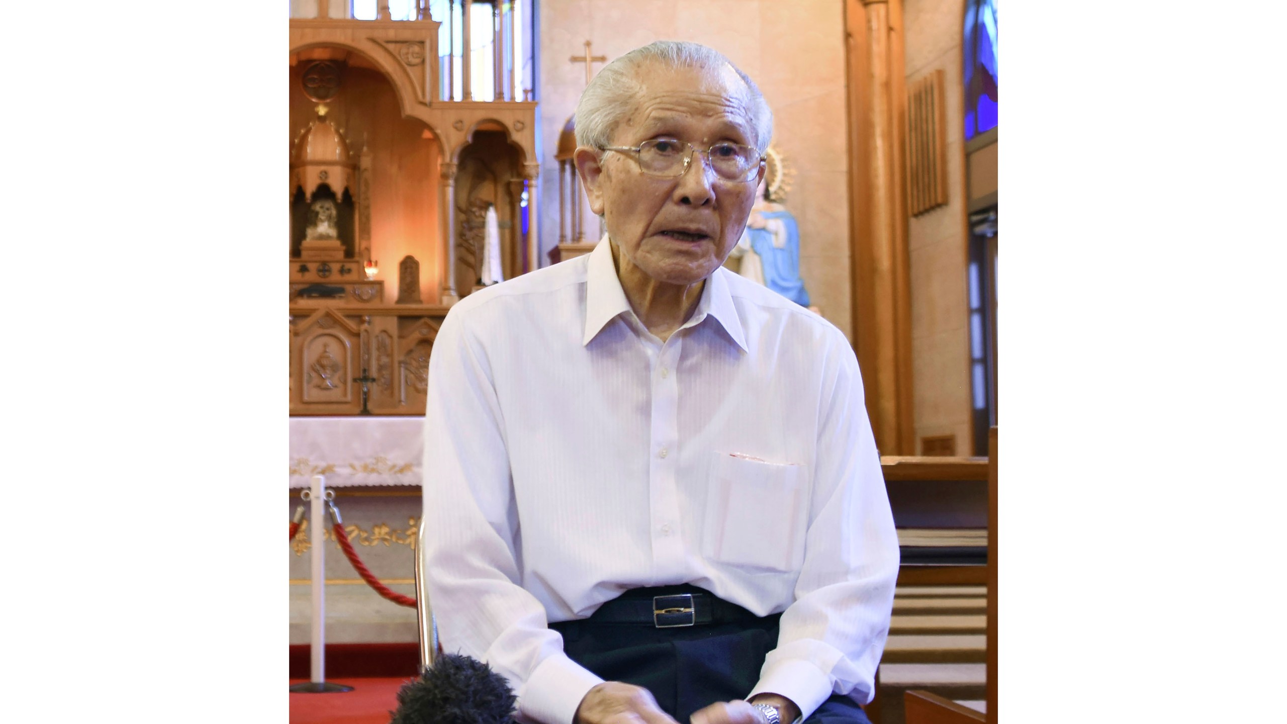 FILE - Shigemi Fukahori is interviewed at the Urakami Cathedral in Nagasaki, southern Japan, on July 29, 2020. Shigemi Fukahori, a survivor of the 1945 Nagasaki atomic bombing, who devoted his life to praying for peace and the souls of the victims, has died. He was 93. (Kyodo News via AP, File)