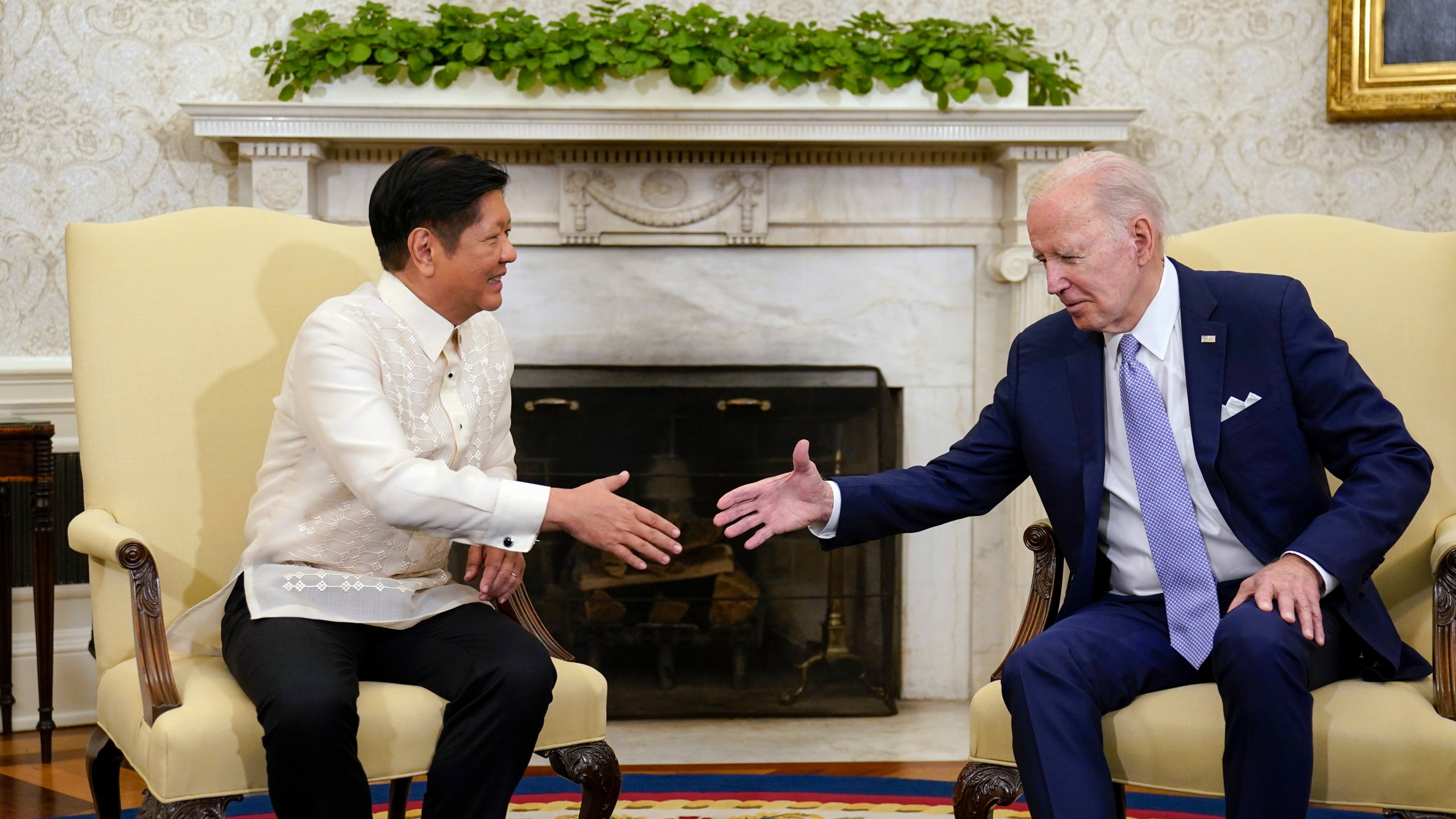 FILE - President Joe Biden, right, shakes hands with Philippines President Ferdinand Marcos Jr. as they meet in the Oval Office of the White House in Washington, on May 1, 2023. (AP Photo/Carolyn Kaster, File)