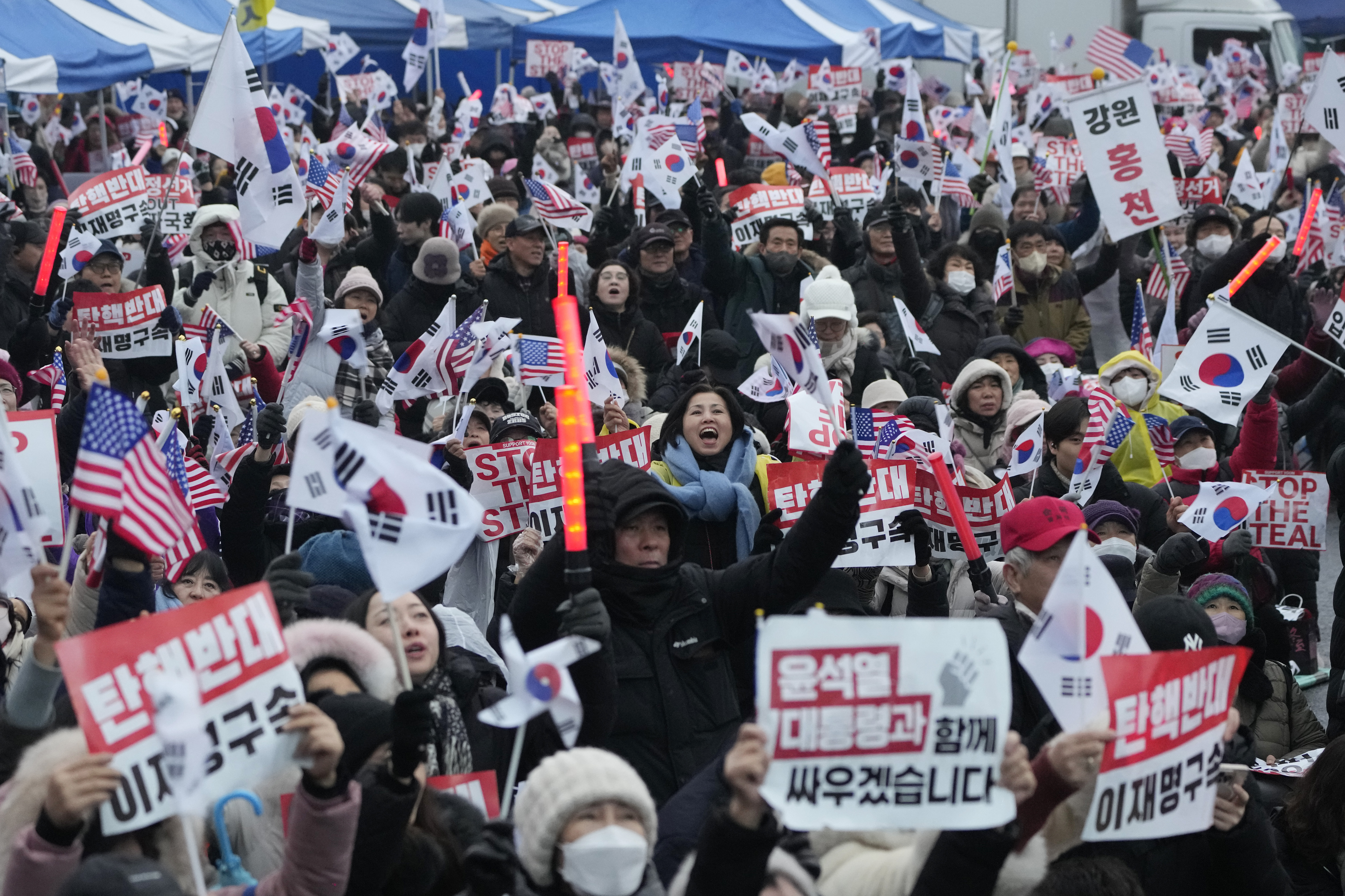 Supporters of impeached South Korean President Yoon Suk Yeol attend a rally to oppose his impeachment near the presidential residence in Seoul, South Korea, Monday, Jan. 6, 2025. (AP Photo/Ahn Young-joon)