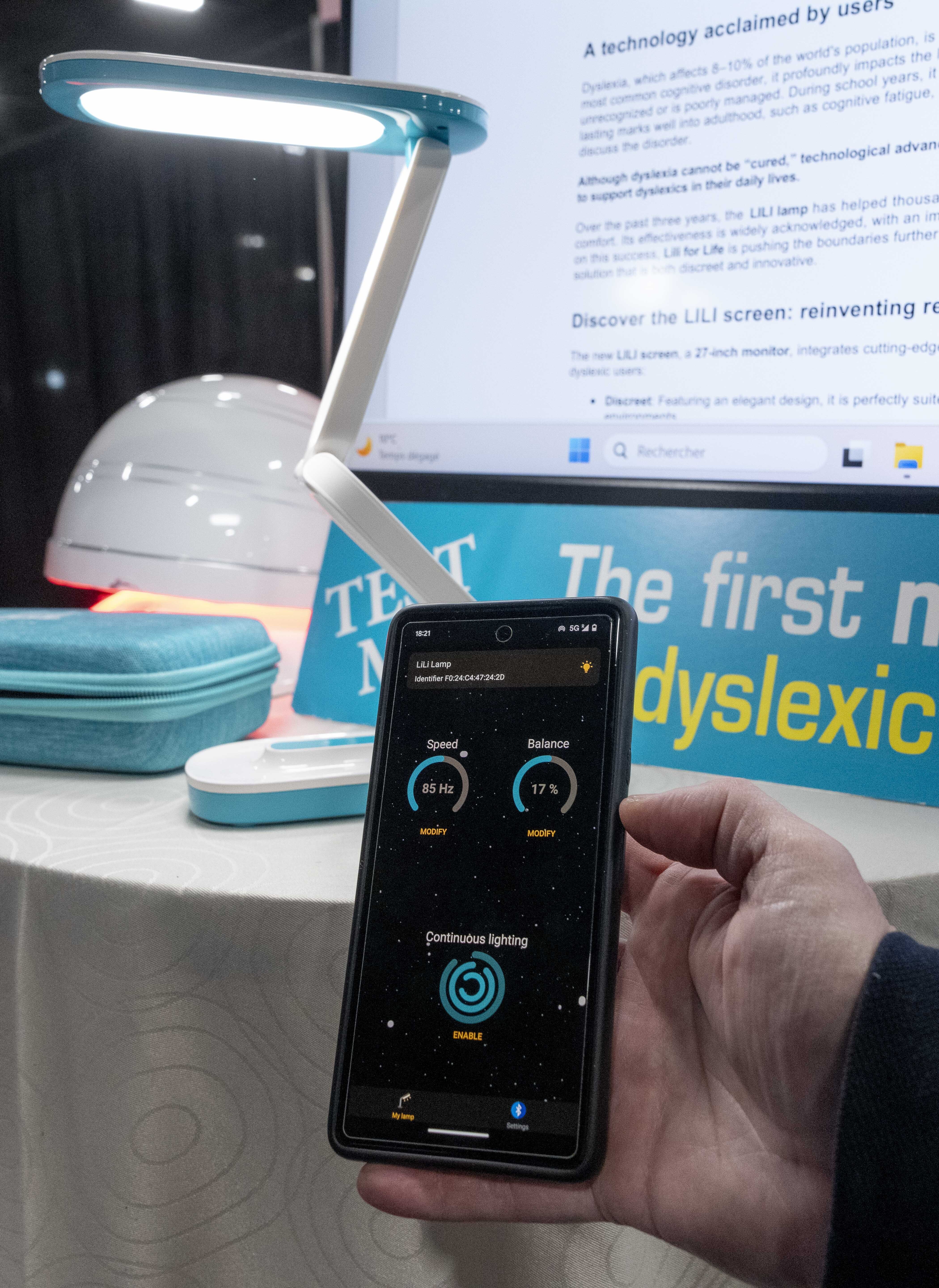 Lili showcases a reading light and monitor with adjustable frequency to help people with dyslexia during 2025 CES Unveiled, Sunday, Jan. 5, 2025, in Las Vegas. (Photo by Jack Dempsey)