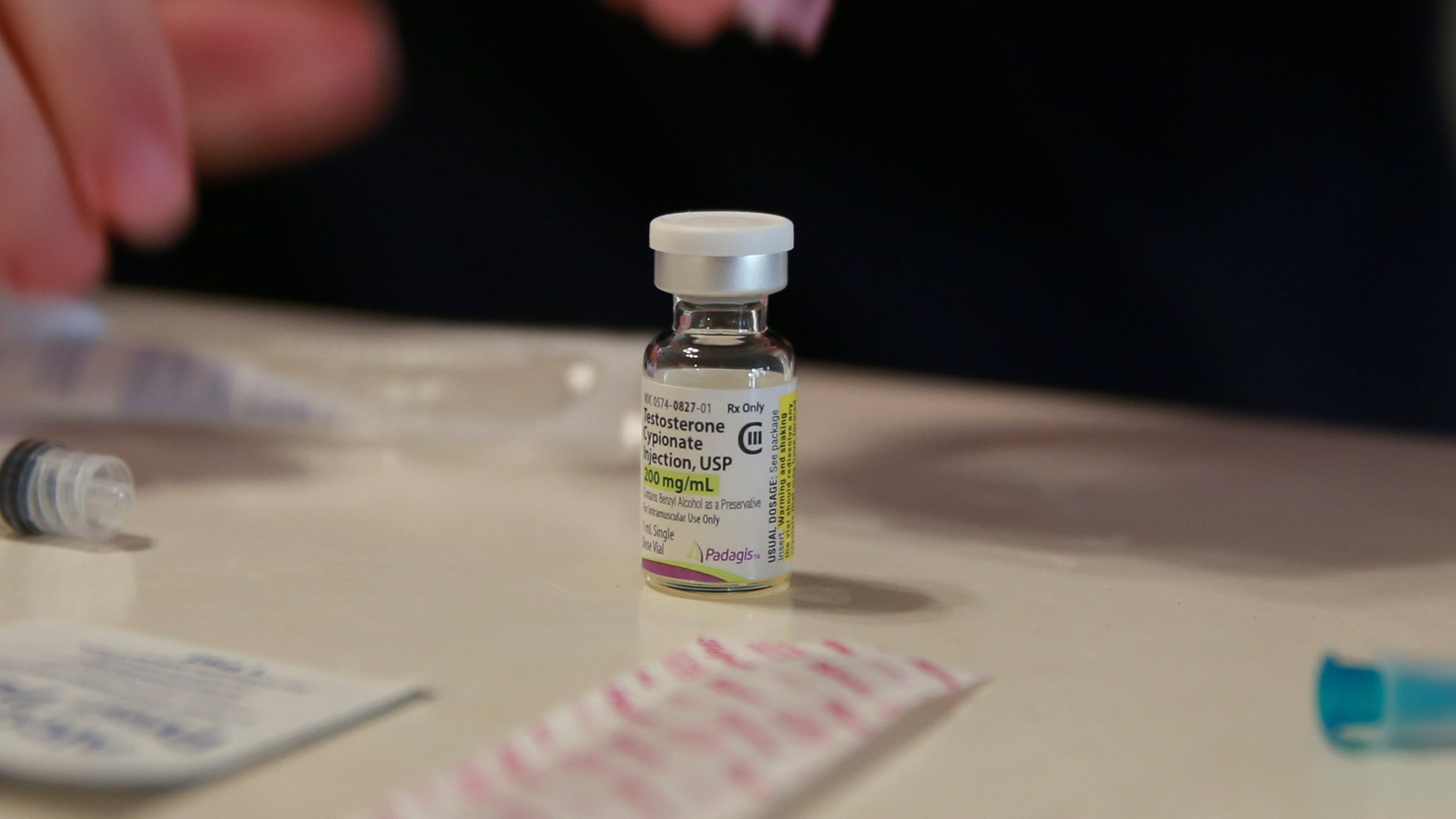 FILE - A vial of testosterone is prepared for injection at a home in Florida, on May 29, 2023. (AP Photo/Laura Bargfeld)