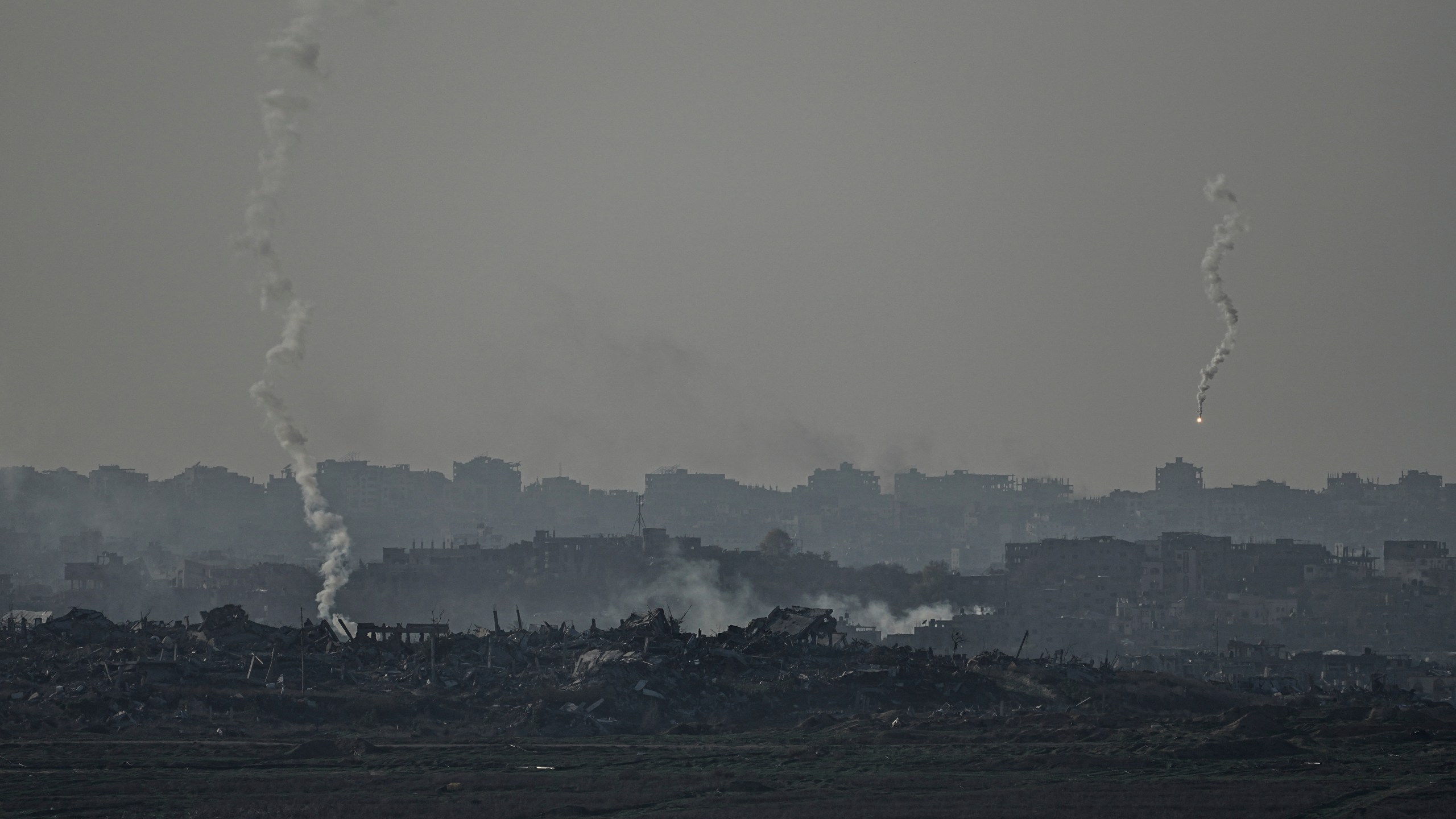 An Israeli army flare is seen over the Gaza Strip, as seen from Sderot, southern Israel, Monday, Jan. 6, 2025. (AP Photo/Tsafrir Abayov)