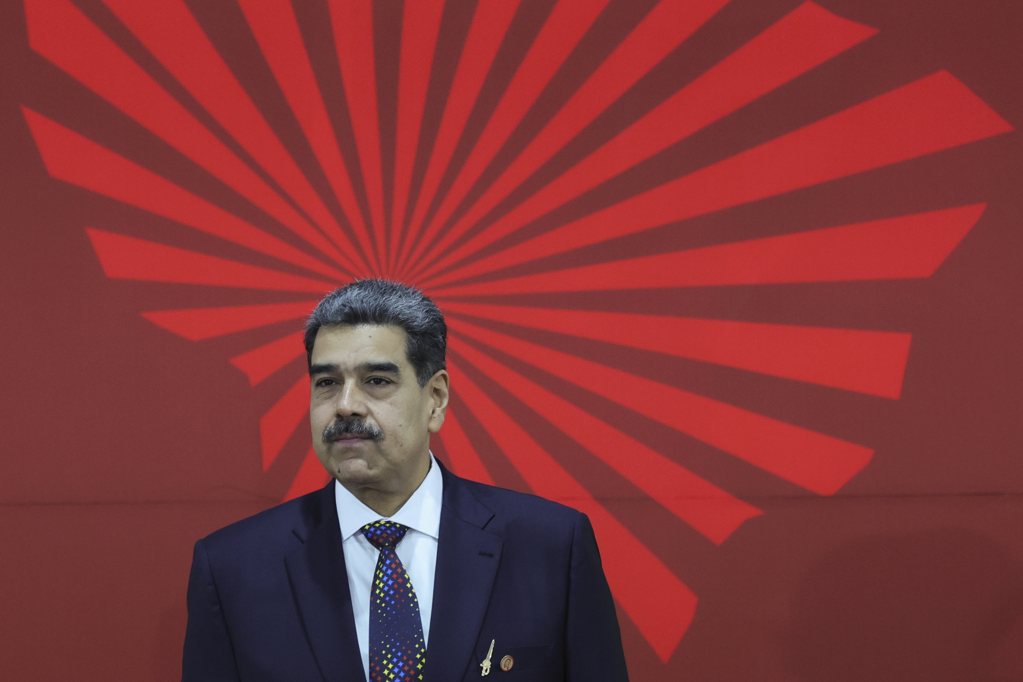 FILE - Venezuelan President Nicolas Maduro waits to receive attendees at the start of the Bolivarian Alliance for the Peoples of Our America (ALBA) Summit in Caracas, Venezuela, Dec. 14, 2024. (AP Photo/Jesus Vargas, File)