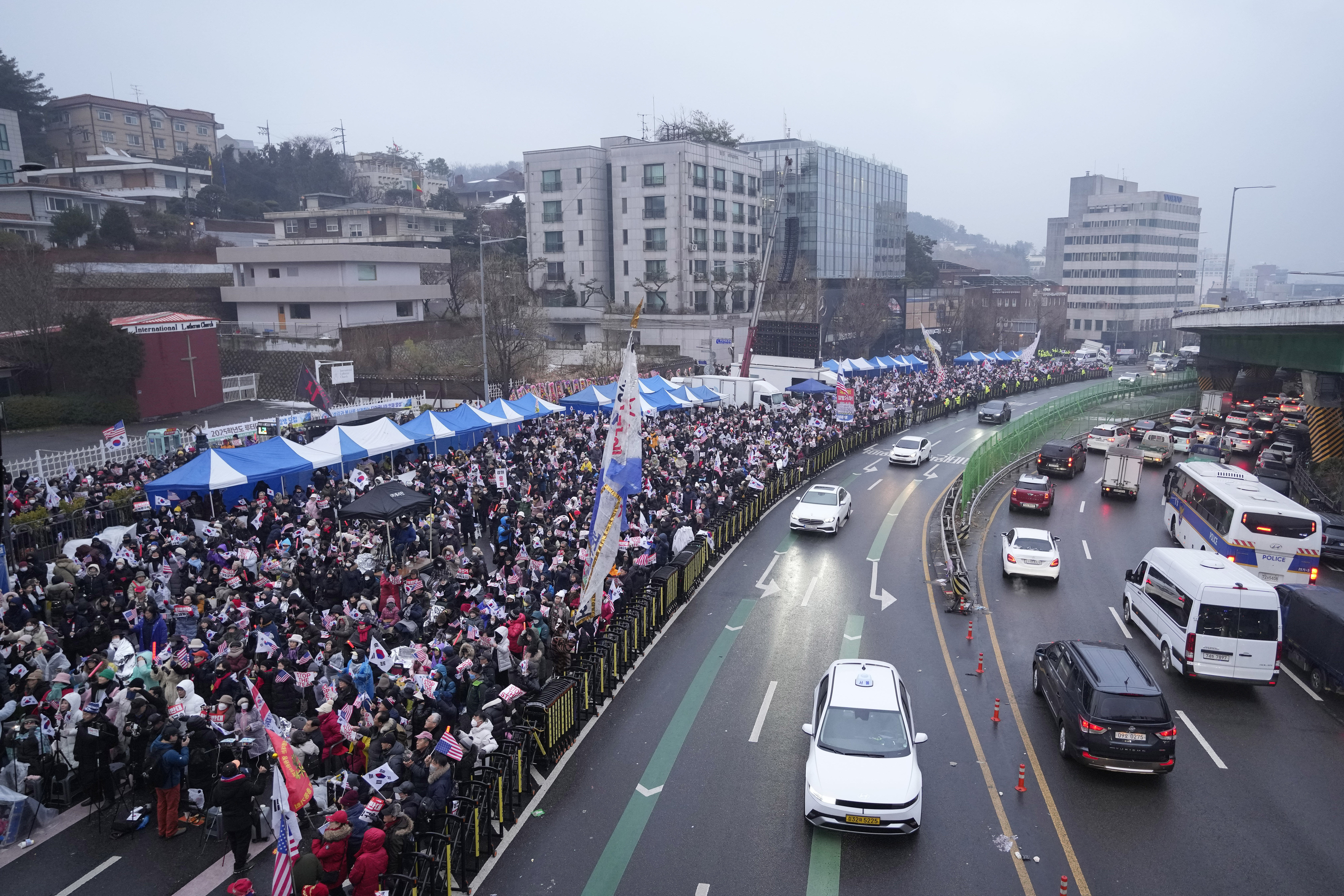 Supporters of impeached South Korean President Yoon Suk Yeol stage a rally to oppose his impeachment near the presidential residence in Seoul, South Korea, Monday, Jan. 6, 2025. (AP Photo/Ahn Young-joon)