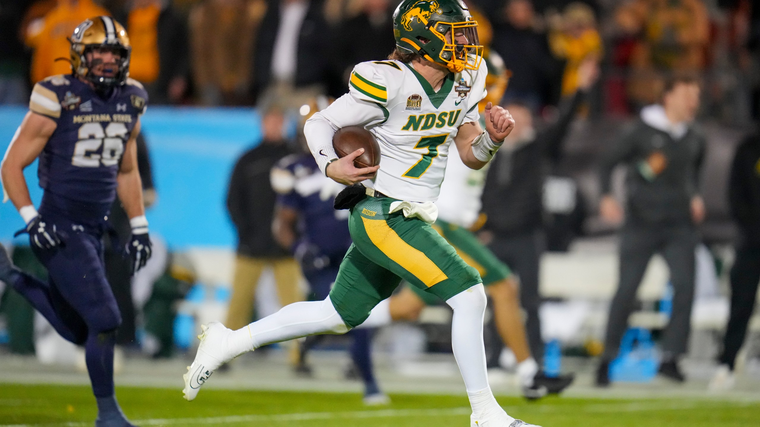 North Dakota State quarterback Cam Miller breaks away from Montana State defensive back Rylan Ortt for a long touchdown run during the first half of the FCS Championship NCAA college football game, Monday, Jan. 6, 2025, in Frisco, Texas. (AP Photo/Julio Cortez)