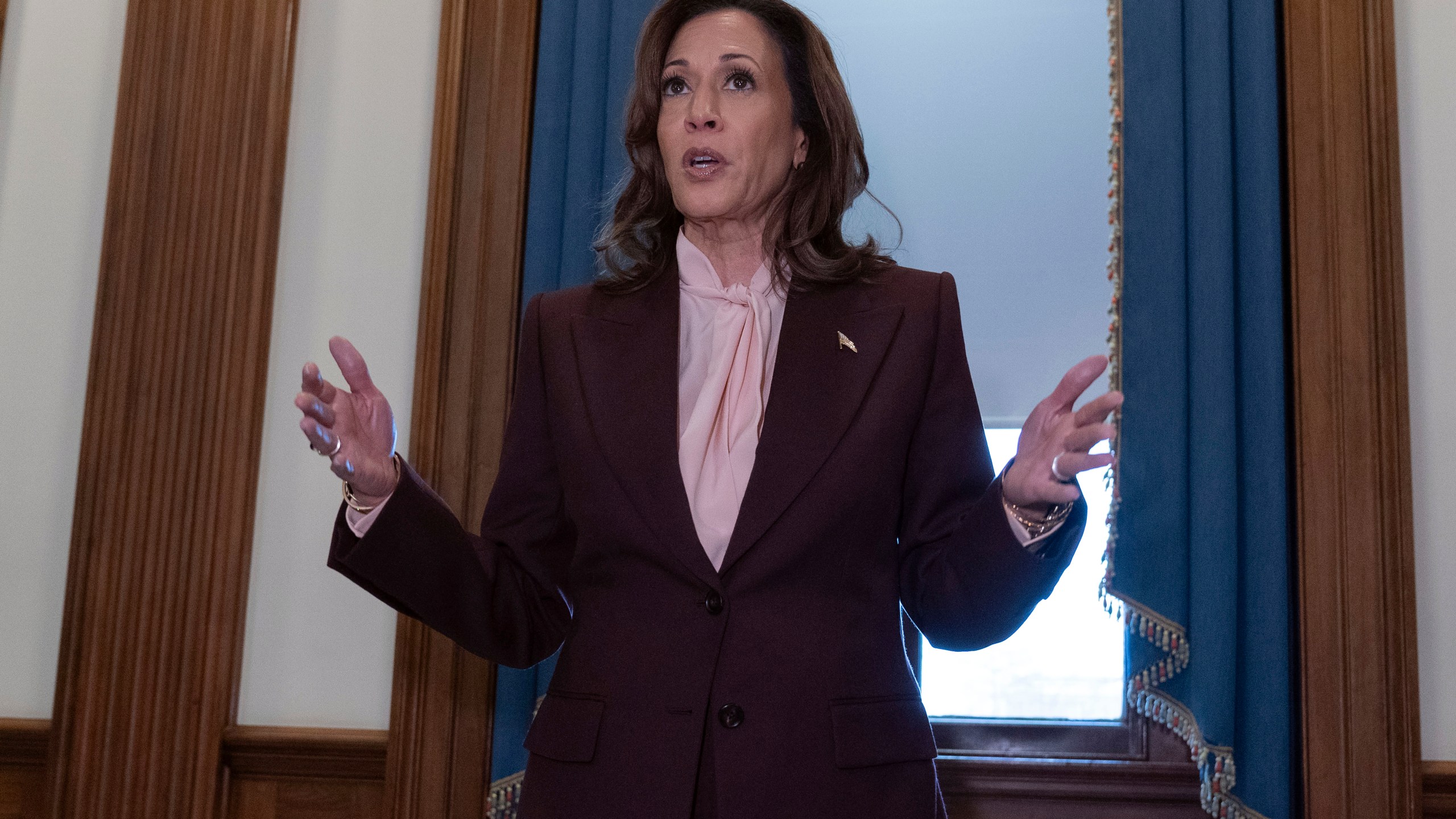 Vice President Kamala Harris talks to reporters after presiding over a joint session of Congress to confirm the Electoral College votes at the Capitol, Monday, Jan. 6, 2025, in Washington. (AP Photo/Jose Luis Magana)