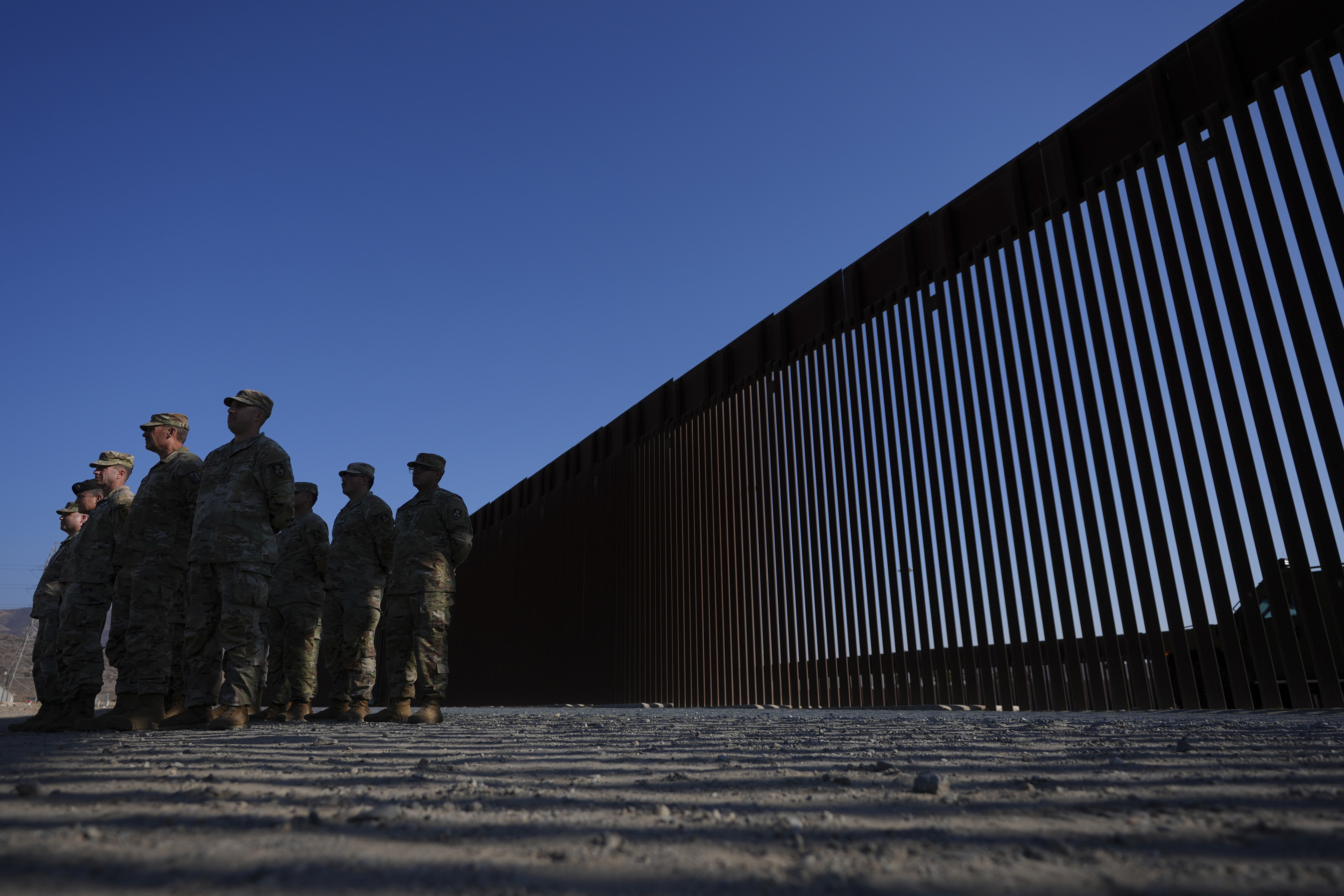 FILE - Members of the California National Guard listne during a news conference near the Otay Mesa Port of Entry along the border with Mexico, Dec. 5, 2024, in San Diego. (AP Photo/Gregory Bull, File)