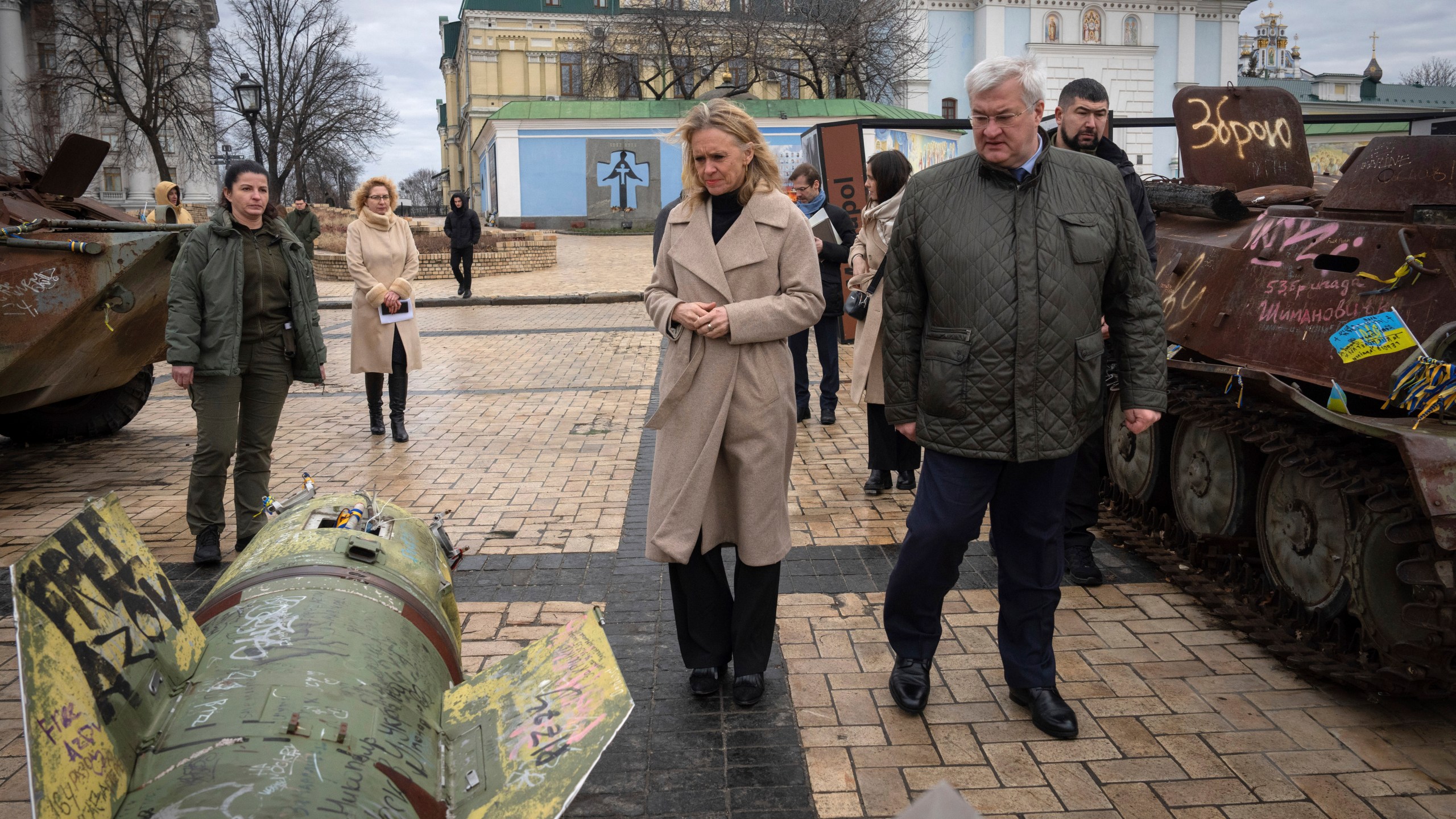 Iceland's Foreign Minister Thorgerdur Katrin Gunnarsdottir, left, and Ukraine's Foreign Minister Andriiy Sybiha look at fragments of Russian rocket in central Kyiv, Ukraine, Tuesday, Jan. 7, 2025. (AP Photo/Efrem Lukatsky)