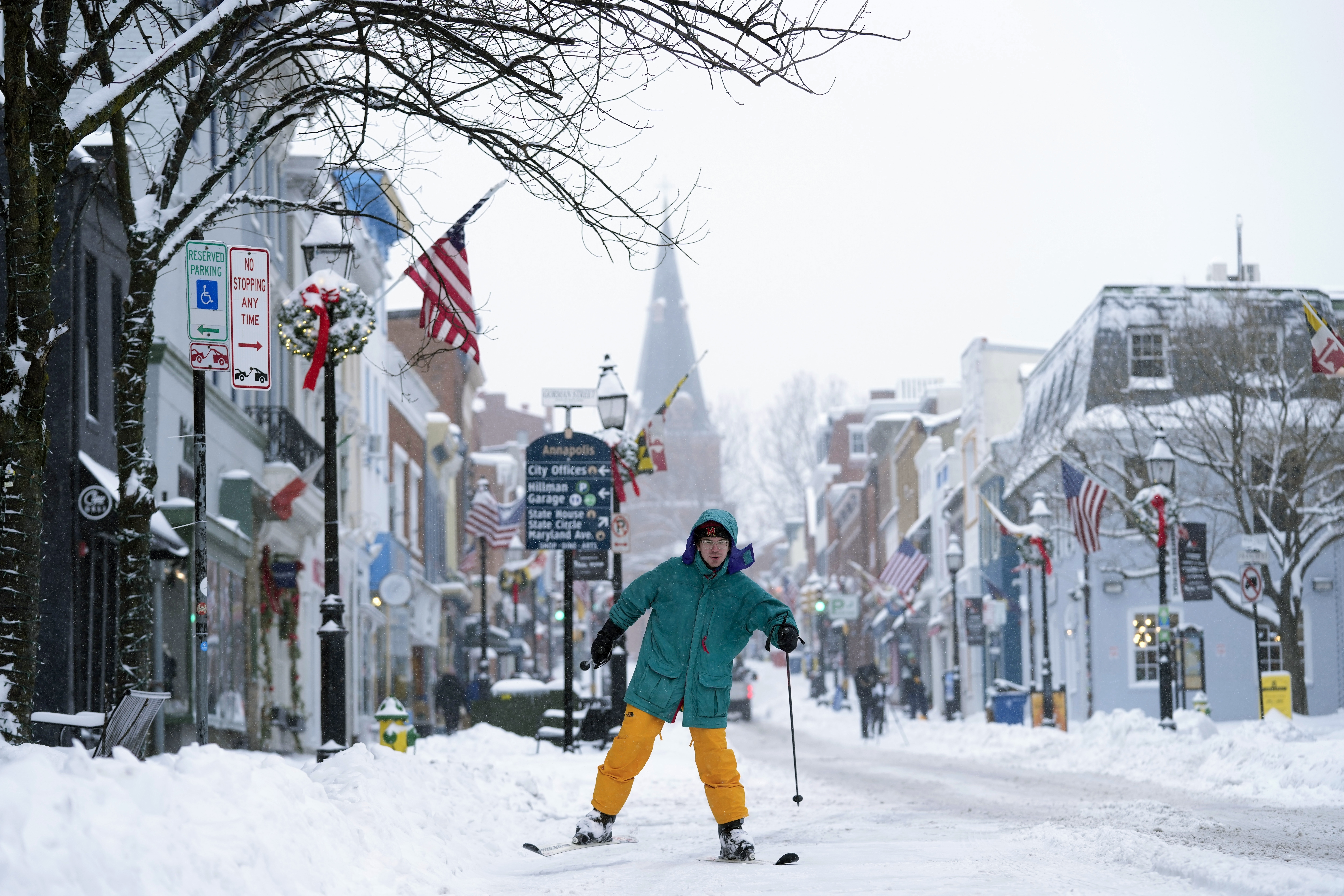 FILE - Cosimos Cendo, of Washington, D.C., skis down Main Street in Annapolis, Md., Monday, Jan. 6, 2025, during a snow storm. (AP Photo/Susan Walsh, File)